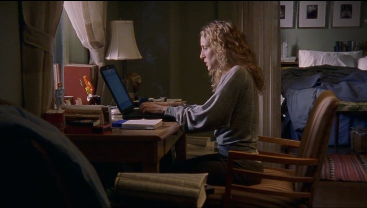 Carrie Bradshaw typing at her laptop, embodying peak “getting my life together” energy that you need for admin night.