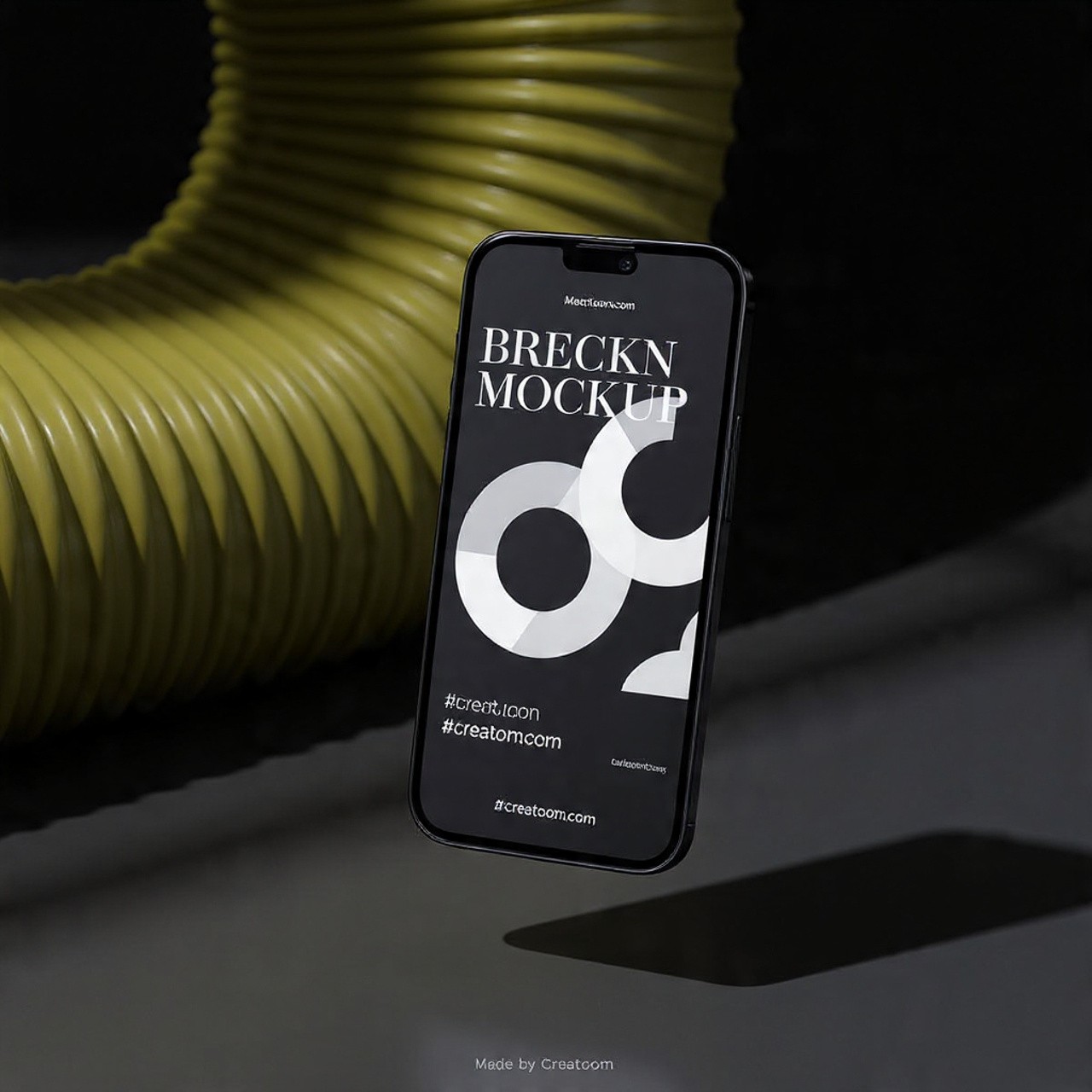 Smartphone mockup with a black and white graphic floating next to a coil.