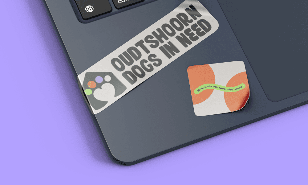 A loptop with sticker on it.