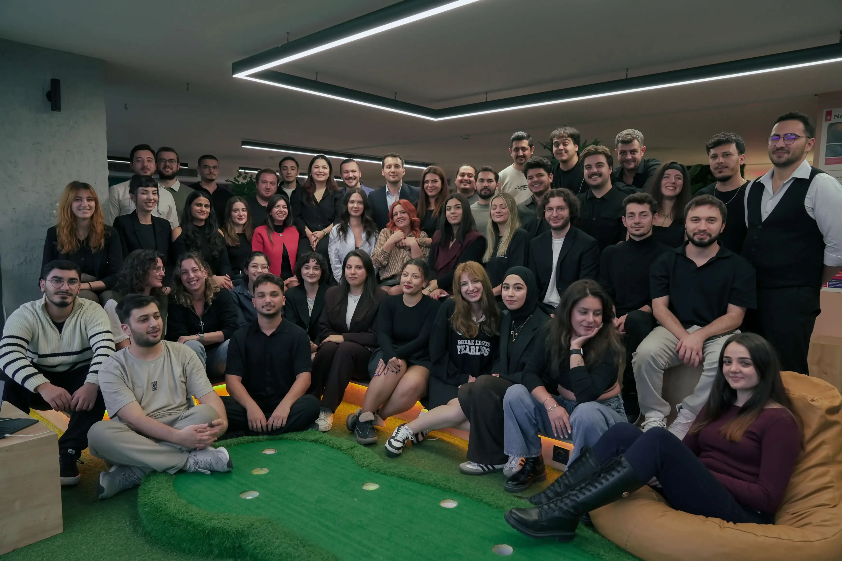 Team members at Neon Apps laughing together in the office environment