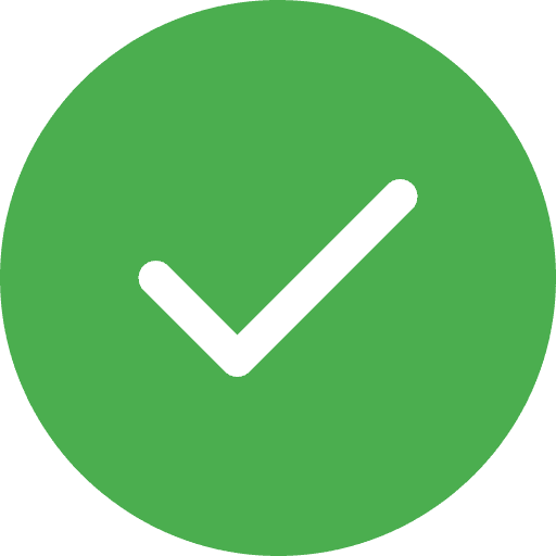 Man in apron stands in rustic kitchen, hands dusted with flour.