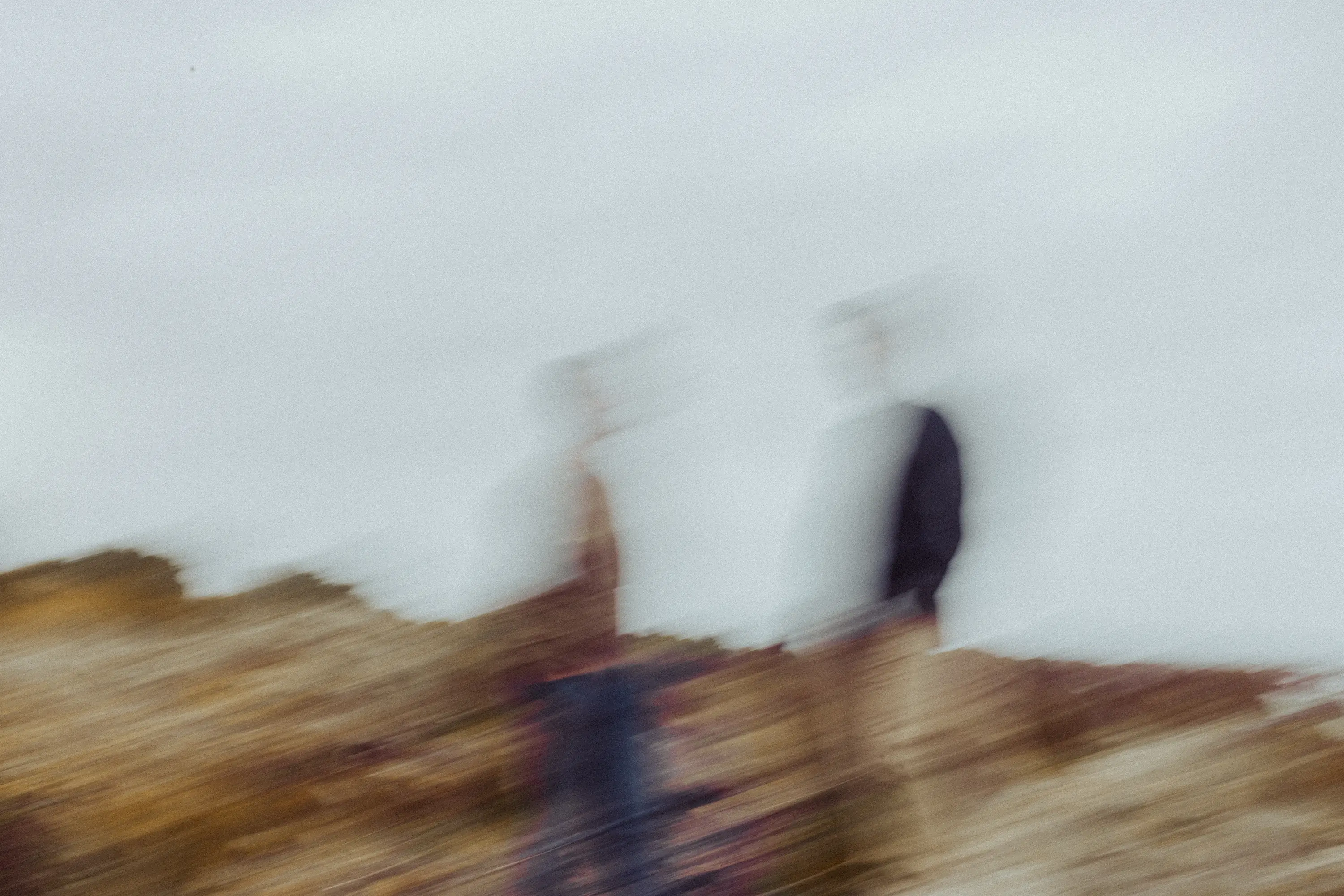 Blurred image of two people standing