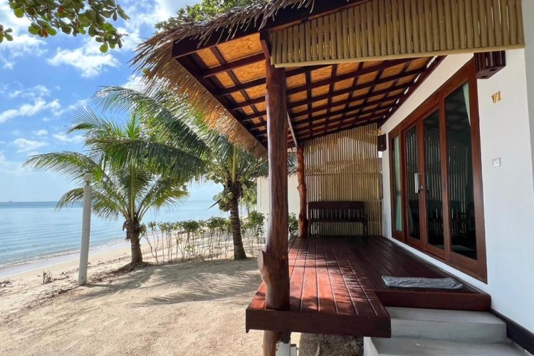 sunloungers fronting buildings near mountain