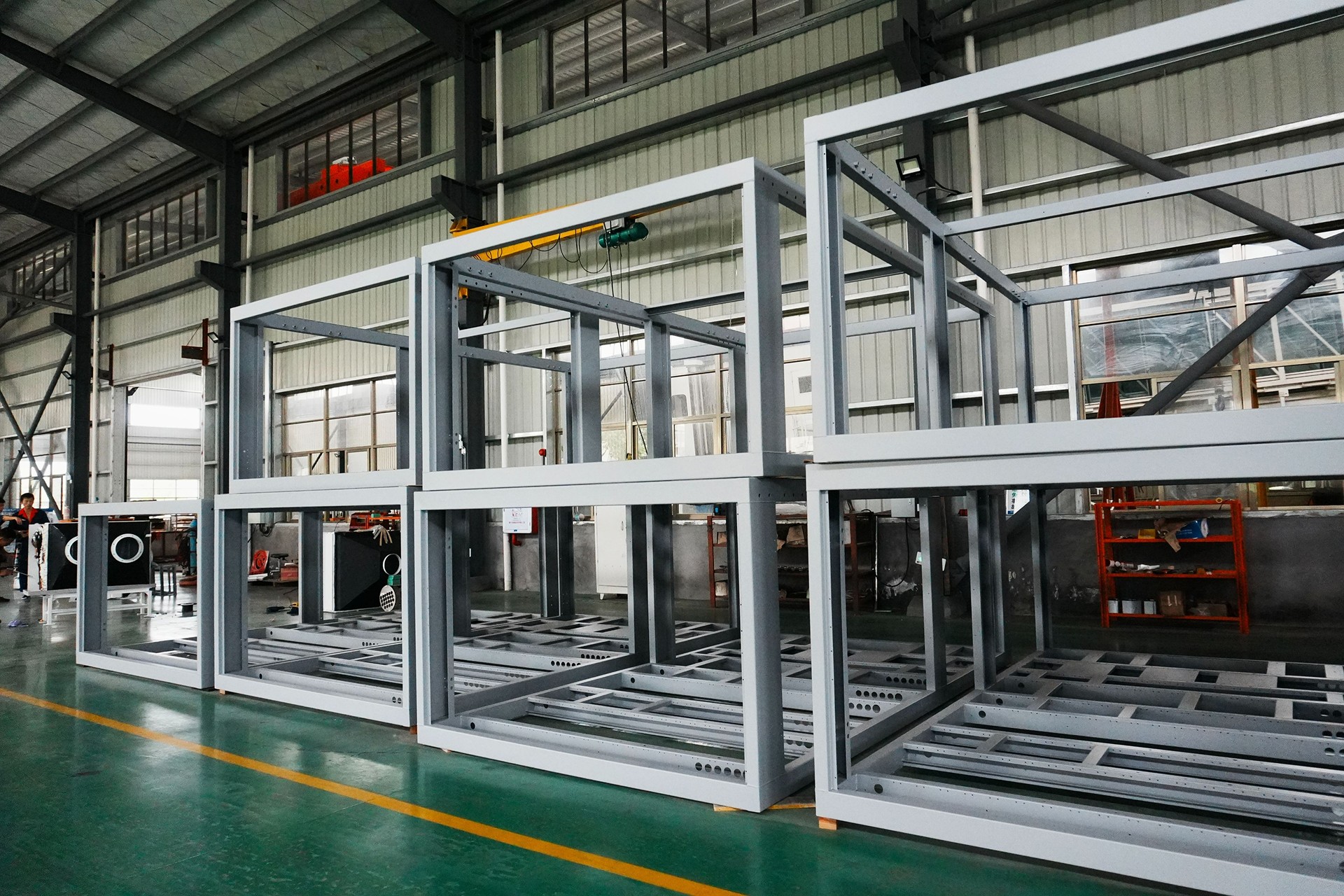 Structural frames for YCair aircraft air conditioning units during manufacturing.