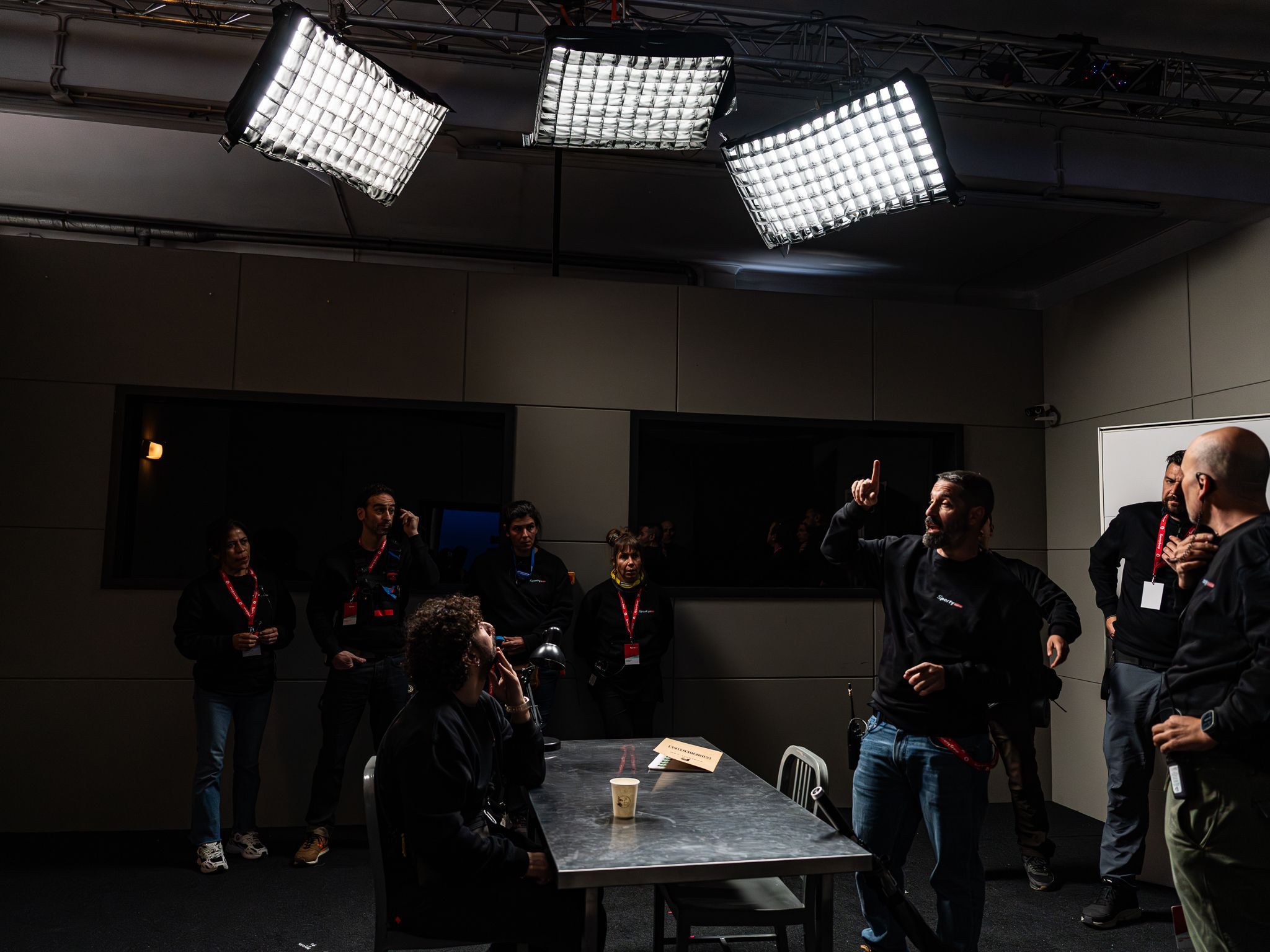 Wide view of the interrogation-room set for Remember who you are