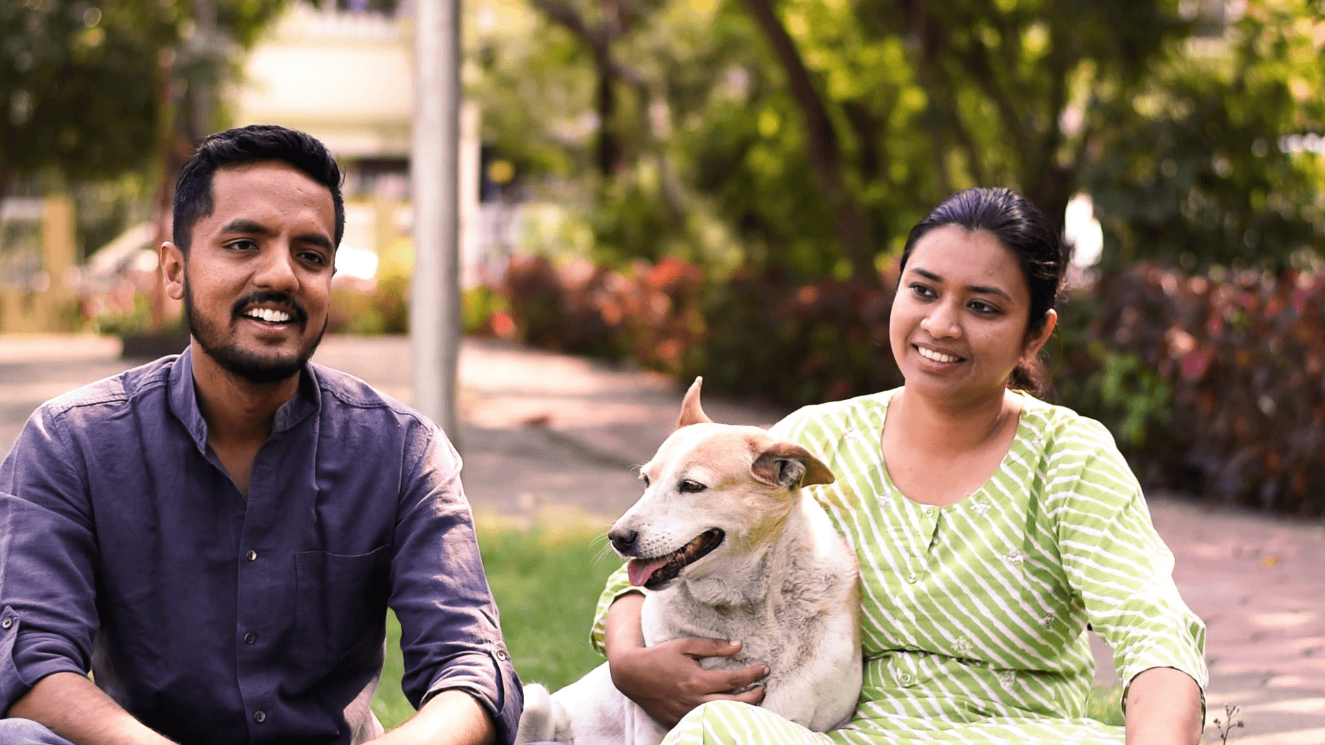 People caring for a rescued dog at Vatika Animal Sanctuary, showing rehabilitation and support