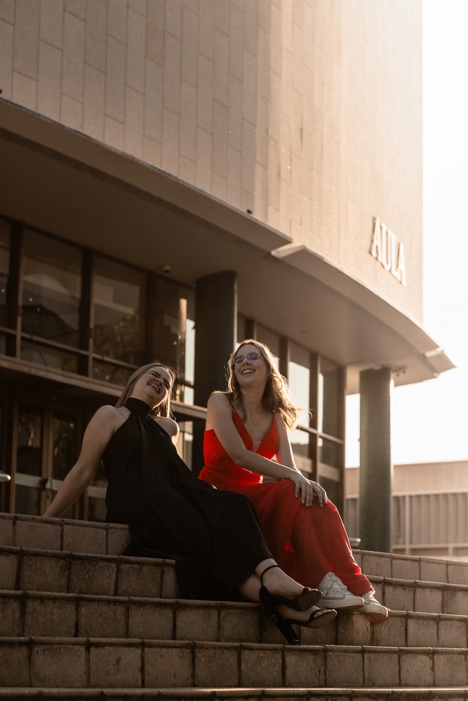 Portrait of friends laughing under golden hour