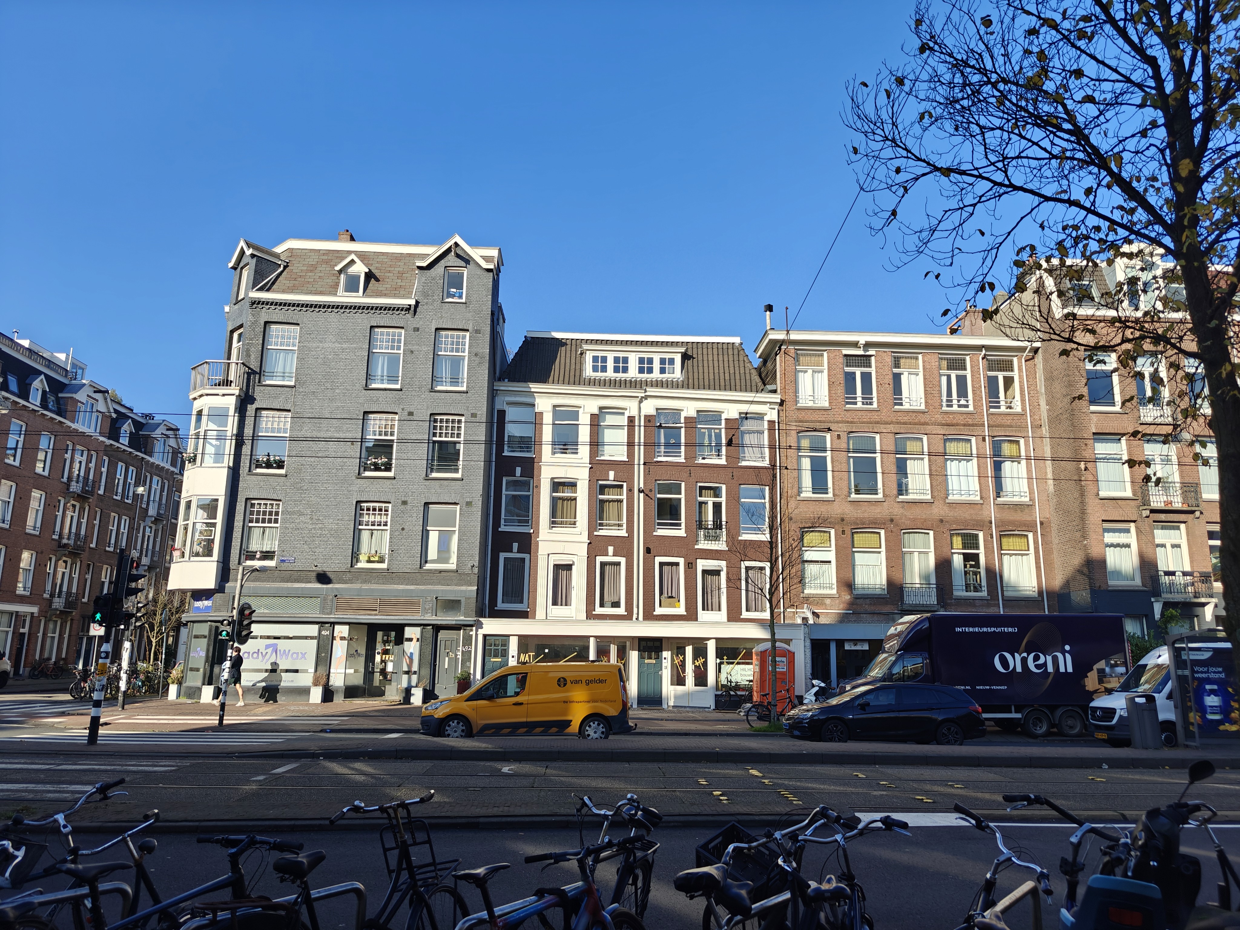 white wooden shelf near white wall