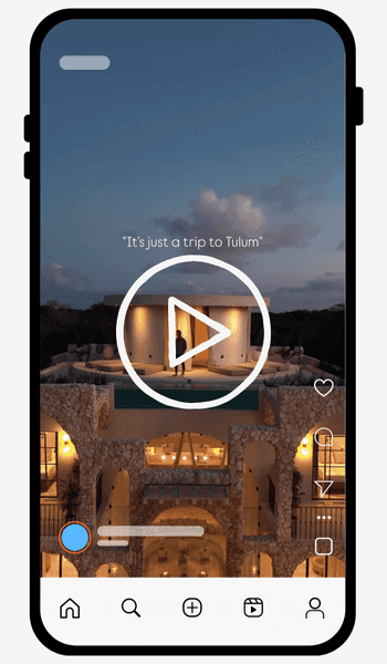 Close-up portrait of a person wearing a gray insulated hooded jacket with the hood up, showing their face framed by the hood against a light background.