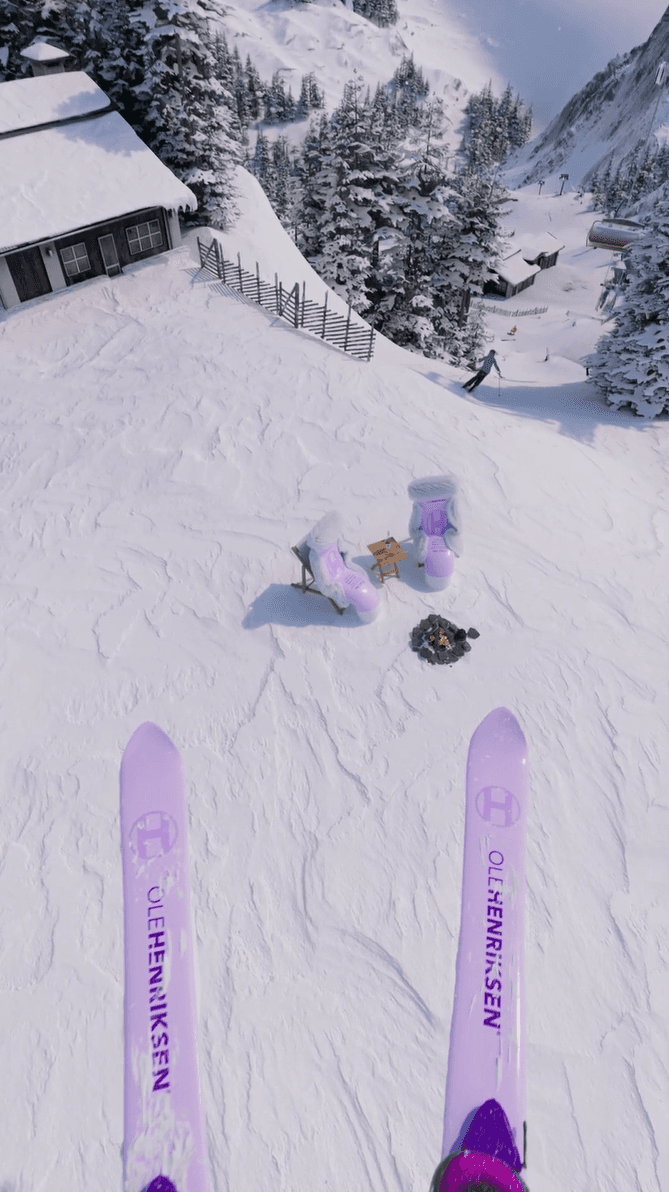 Skier's POV of a snowy slope with purple chairs and a small campfire