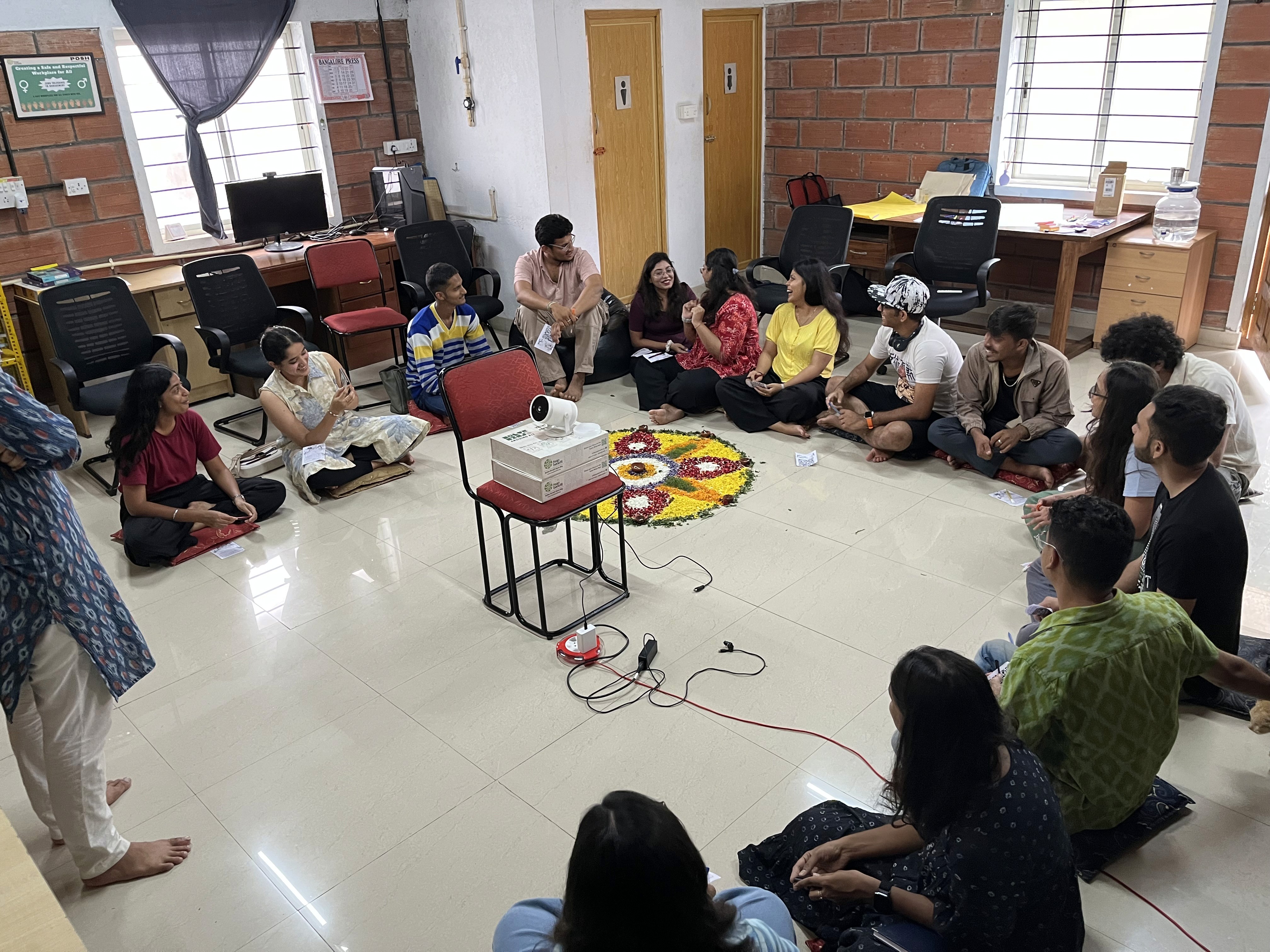 An image of people seated in a circular group for discussion at SolverJam, Bengaluru hosted by Awaaz Leadership Labs