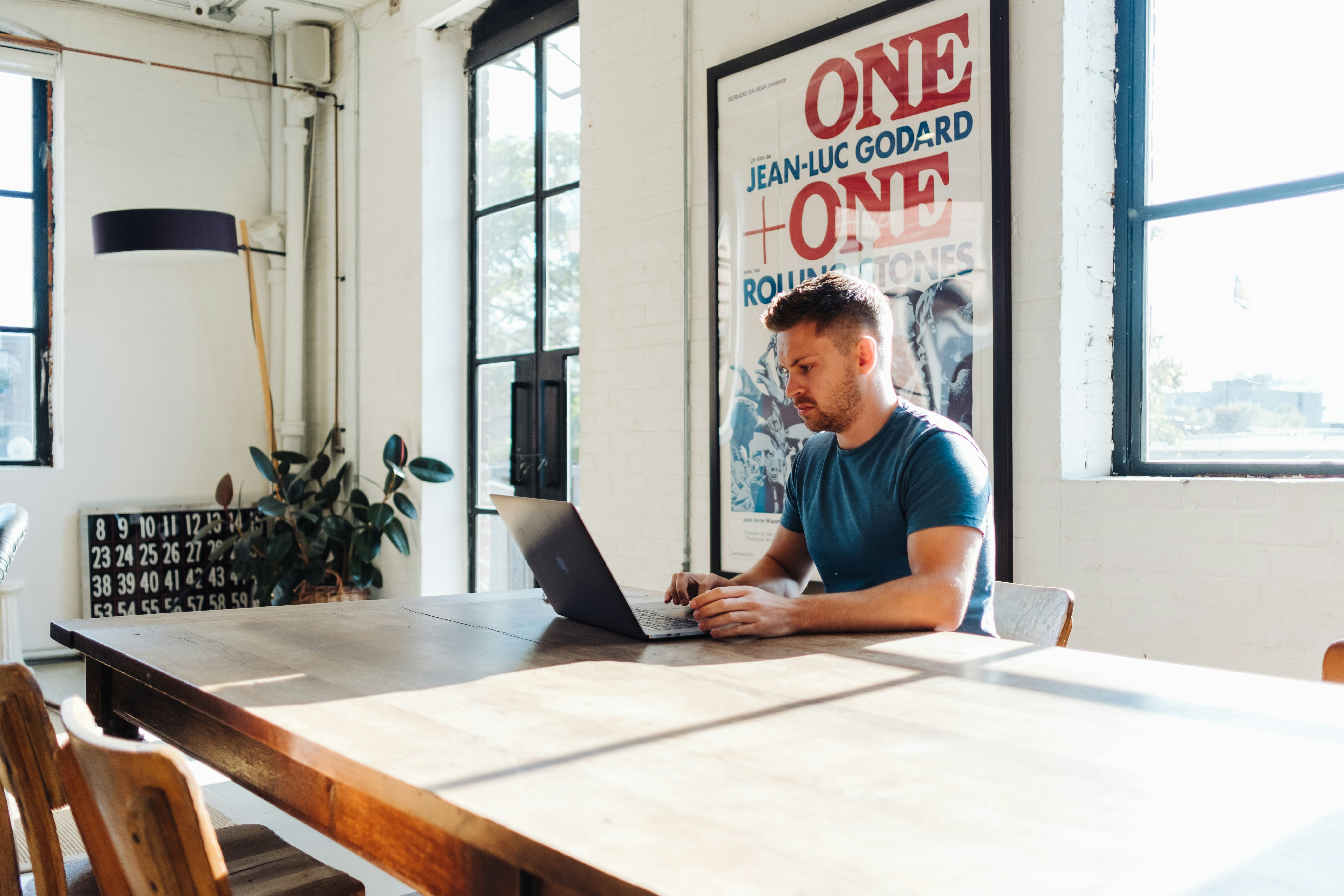 man sitting alone and working - How To Clip A YouTube Video