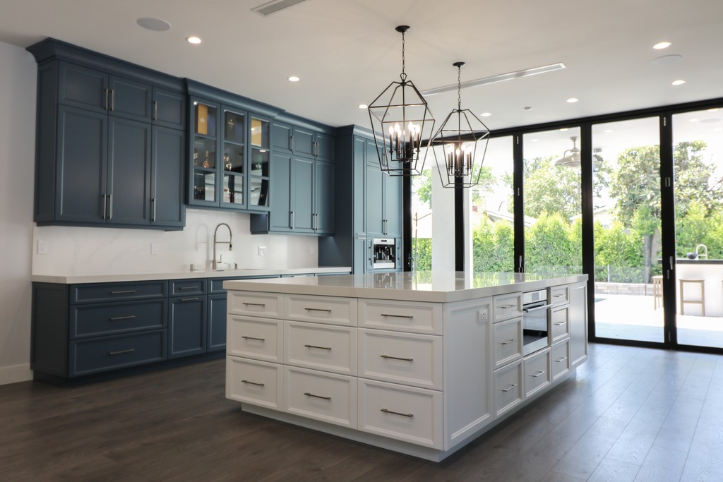 blue and white two tone shaker kitchen with silver handles industrial transitional