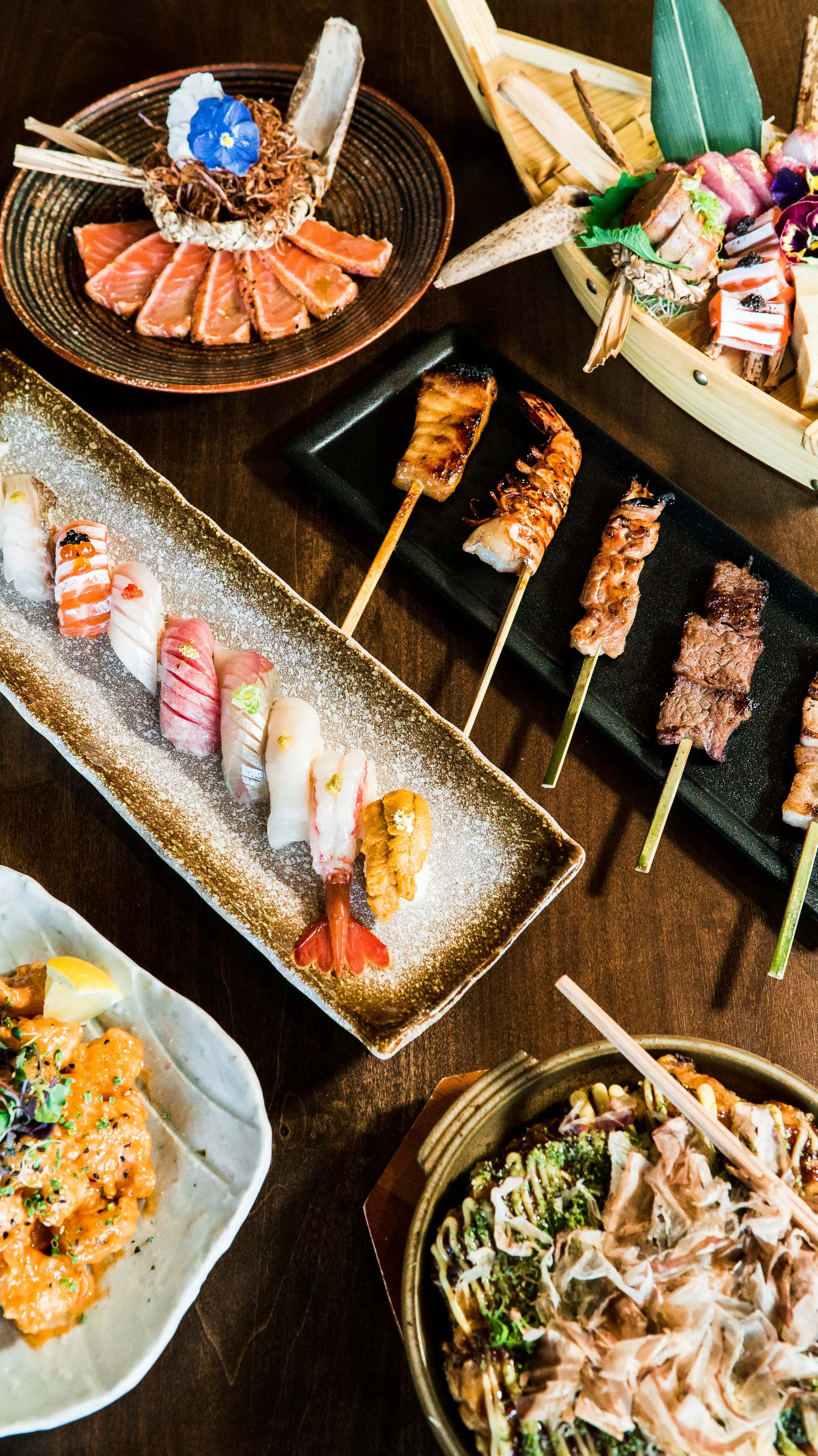 Smoky, grilled yakitori skewers at Izakaya Tora, offering tender chicken and vegetable options with a charred finish that pairs perfectly with sake.