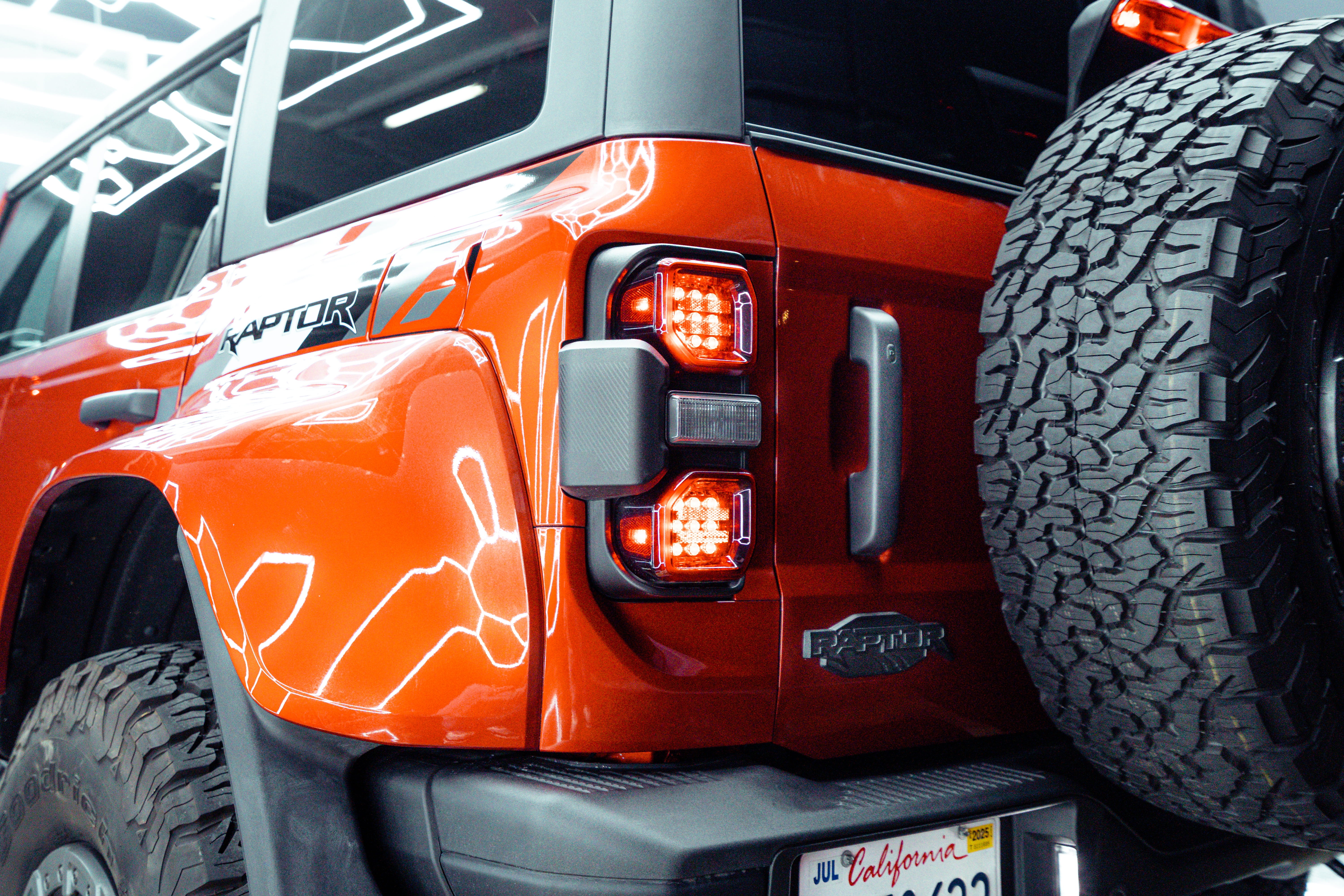 Taillight detail on an orange Ford Bronco Raptor with Icon Rocklear permanent paint protection, Dragon Auto Milpitas