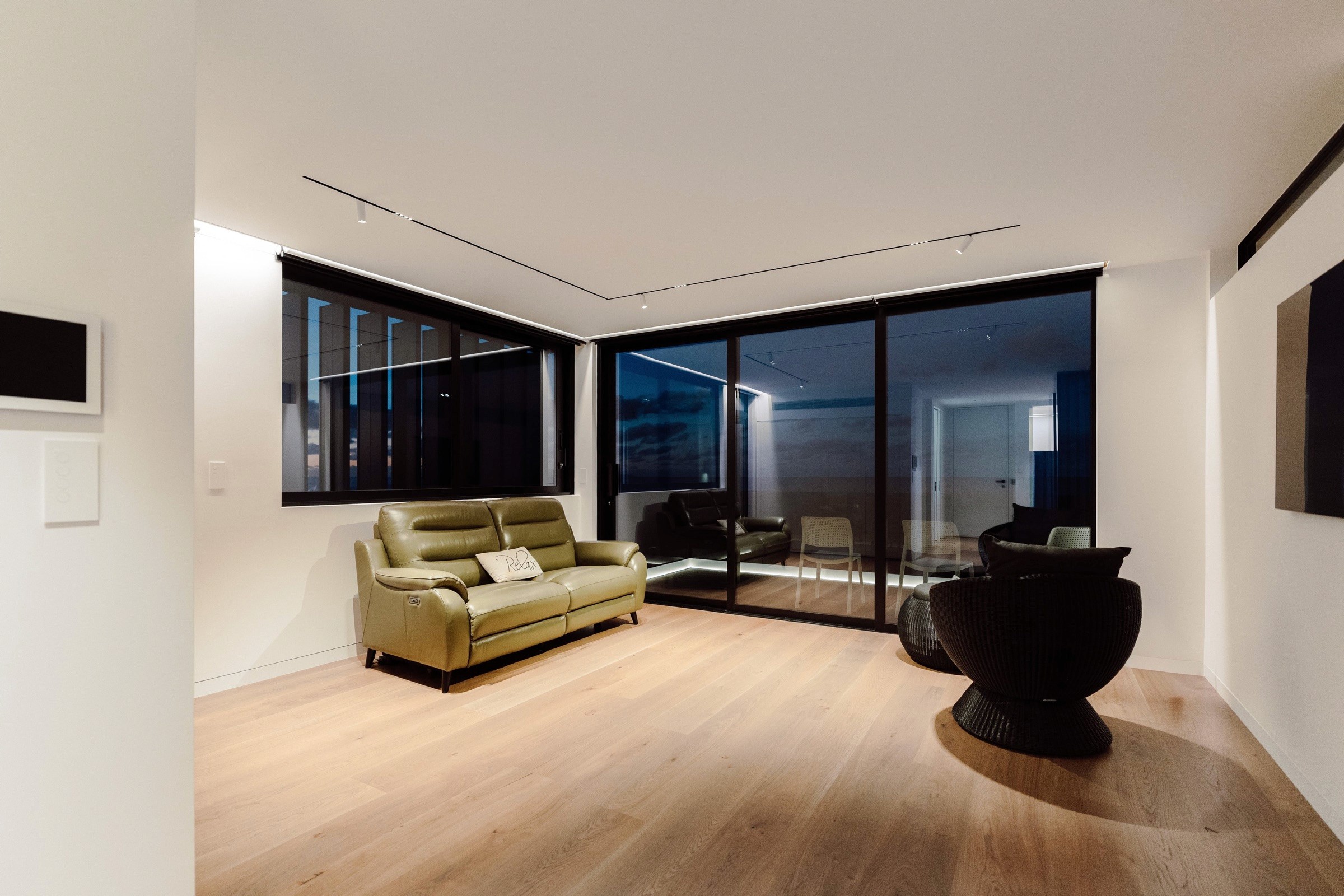 Living room track lighting at dusk
