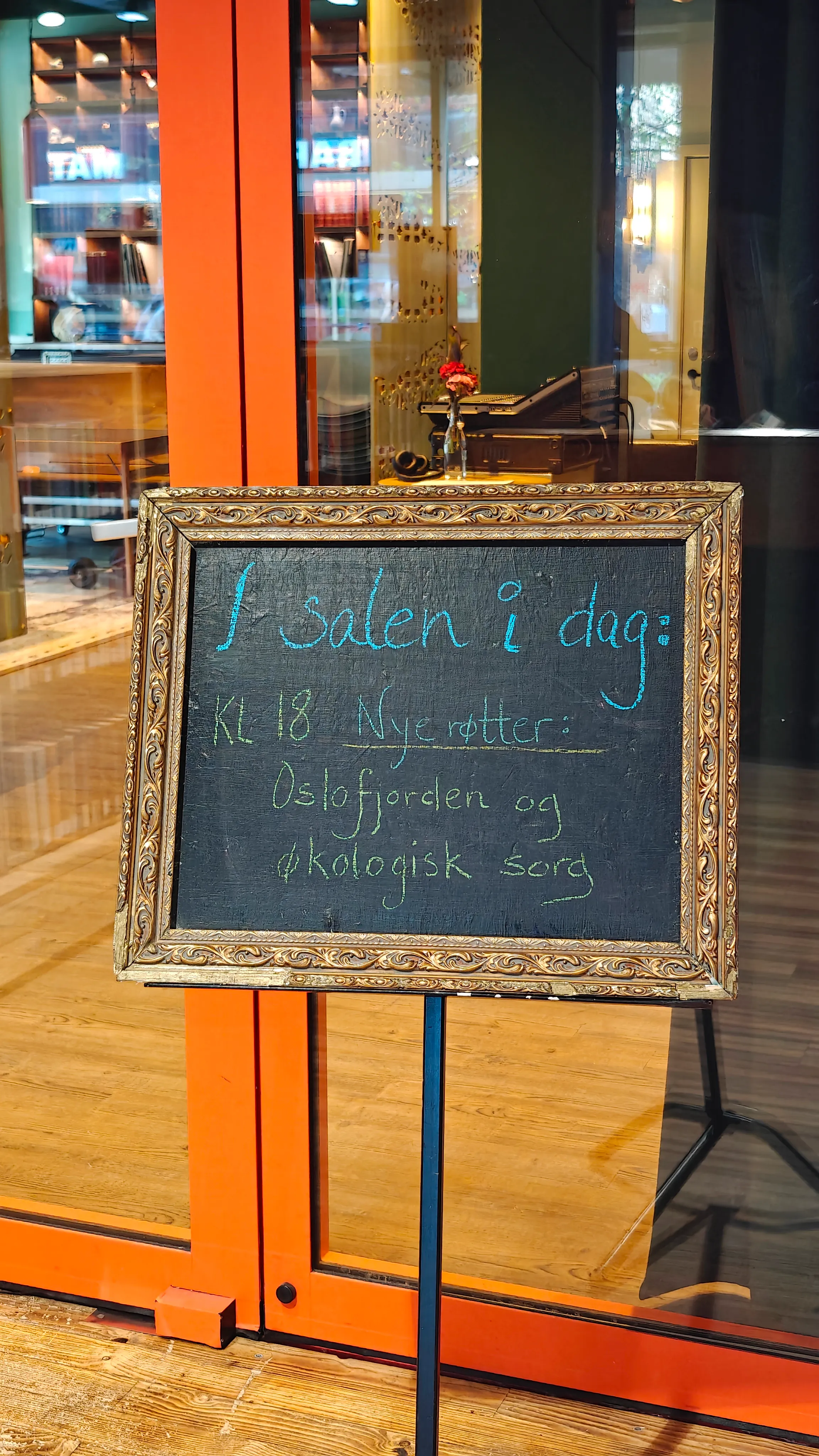 Event details written on a blackboard