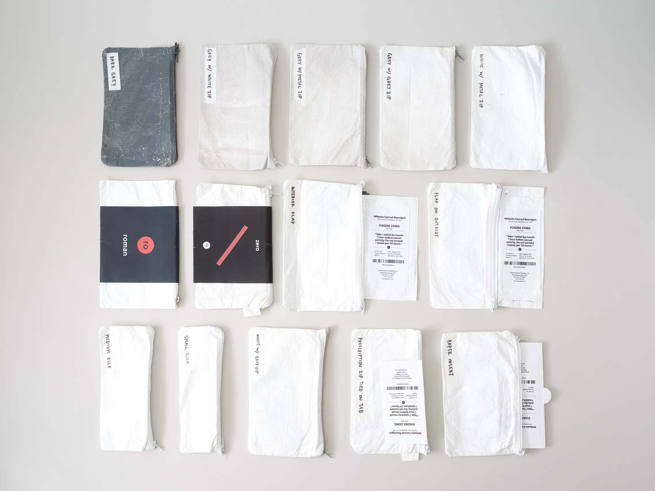 White and black flexible packaging prototypes arranged for comparison