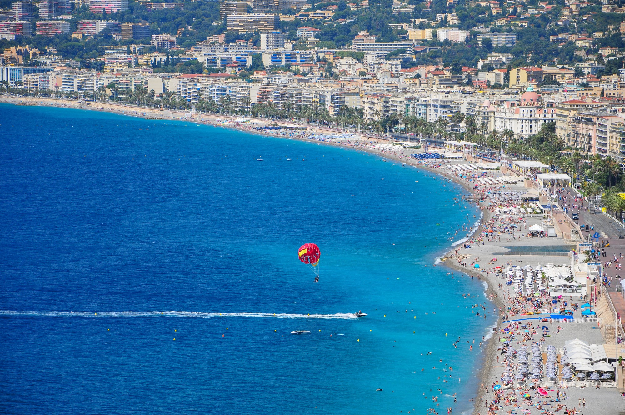 brown wooden beach lounge chair on beach during daytime