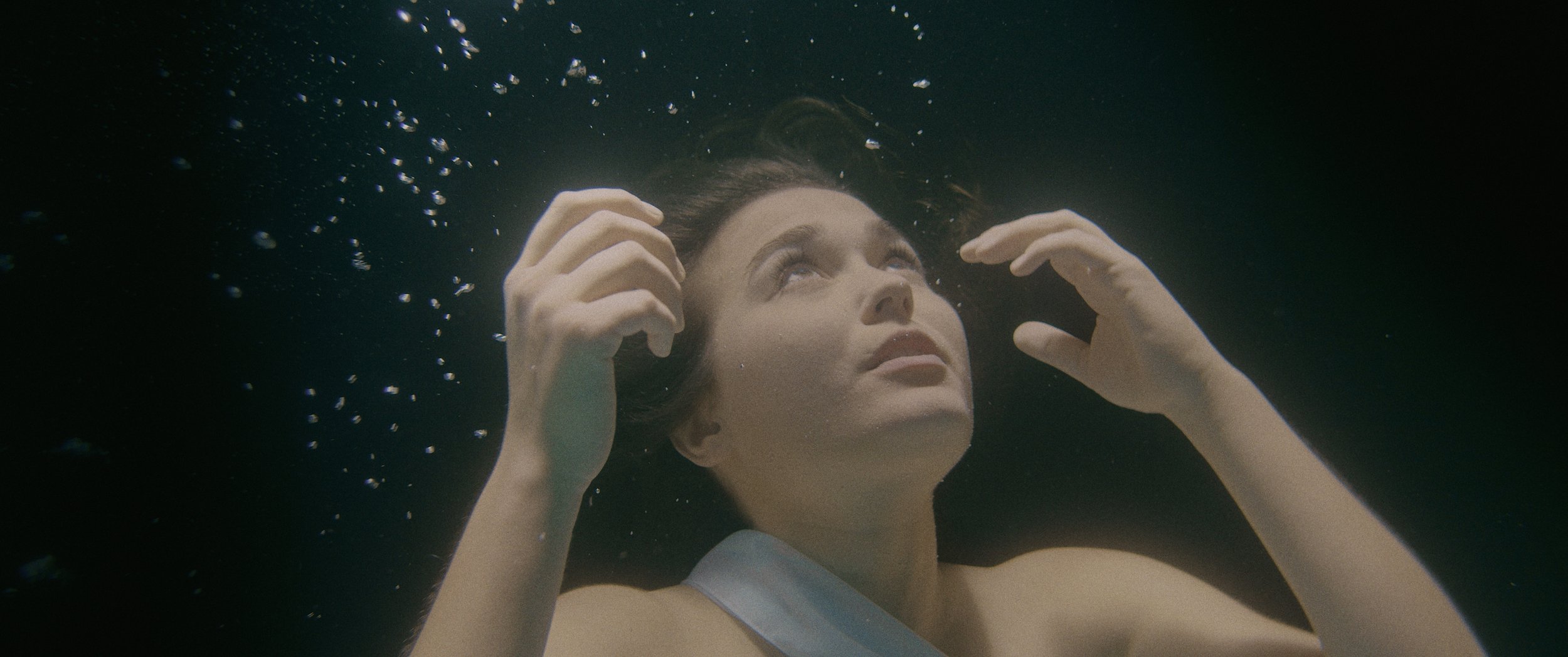 Streetside billboard with flyposters of the Batch.Works brand and illustrations