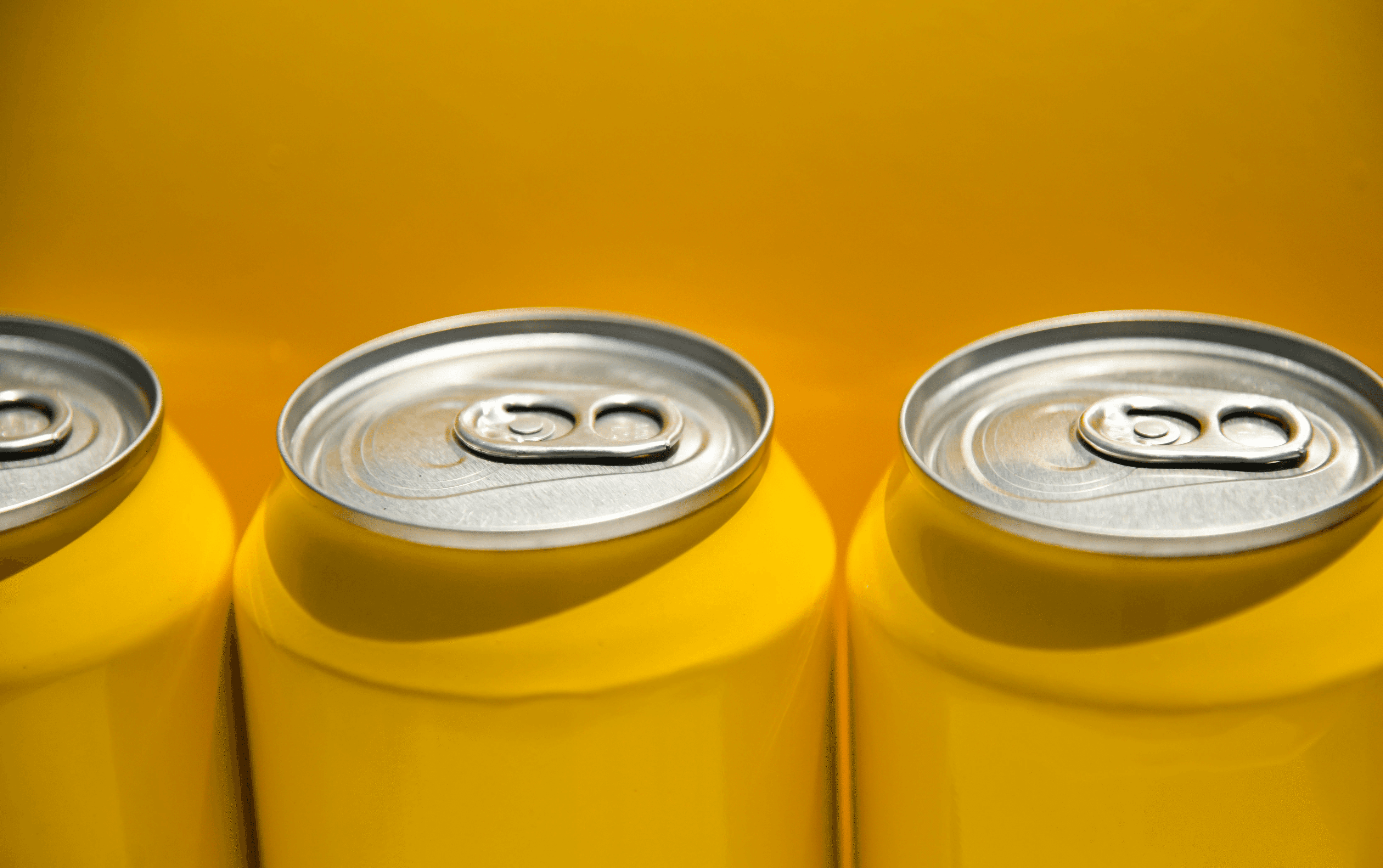Image of 3 drink cans