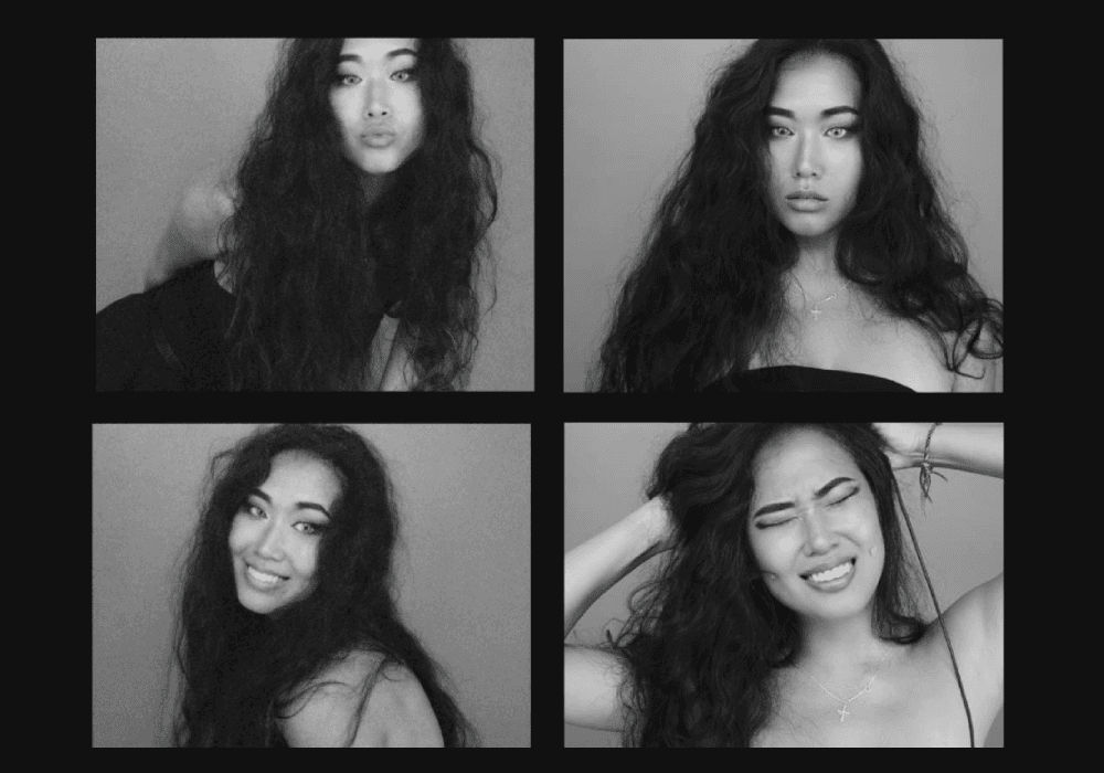 Person with yellow rain jacket looking over at mountains.