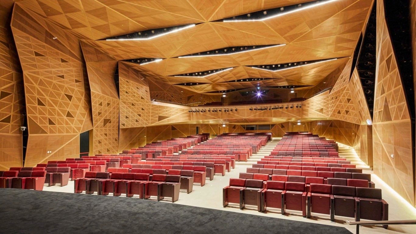 KAFD Conference Center with premium seating arrangements in a desert theme interior.