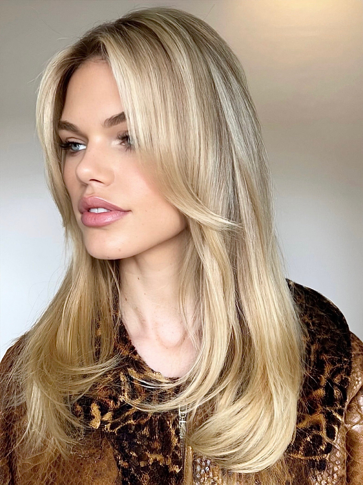 Champagne blonde hair with face-framing highlights at Bomane Salon, Beverly Hills – healthy, bright blonde finish.