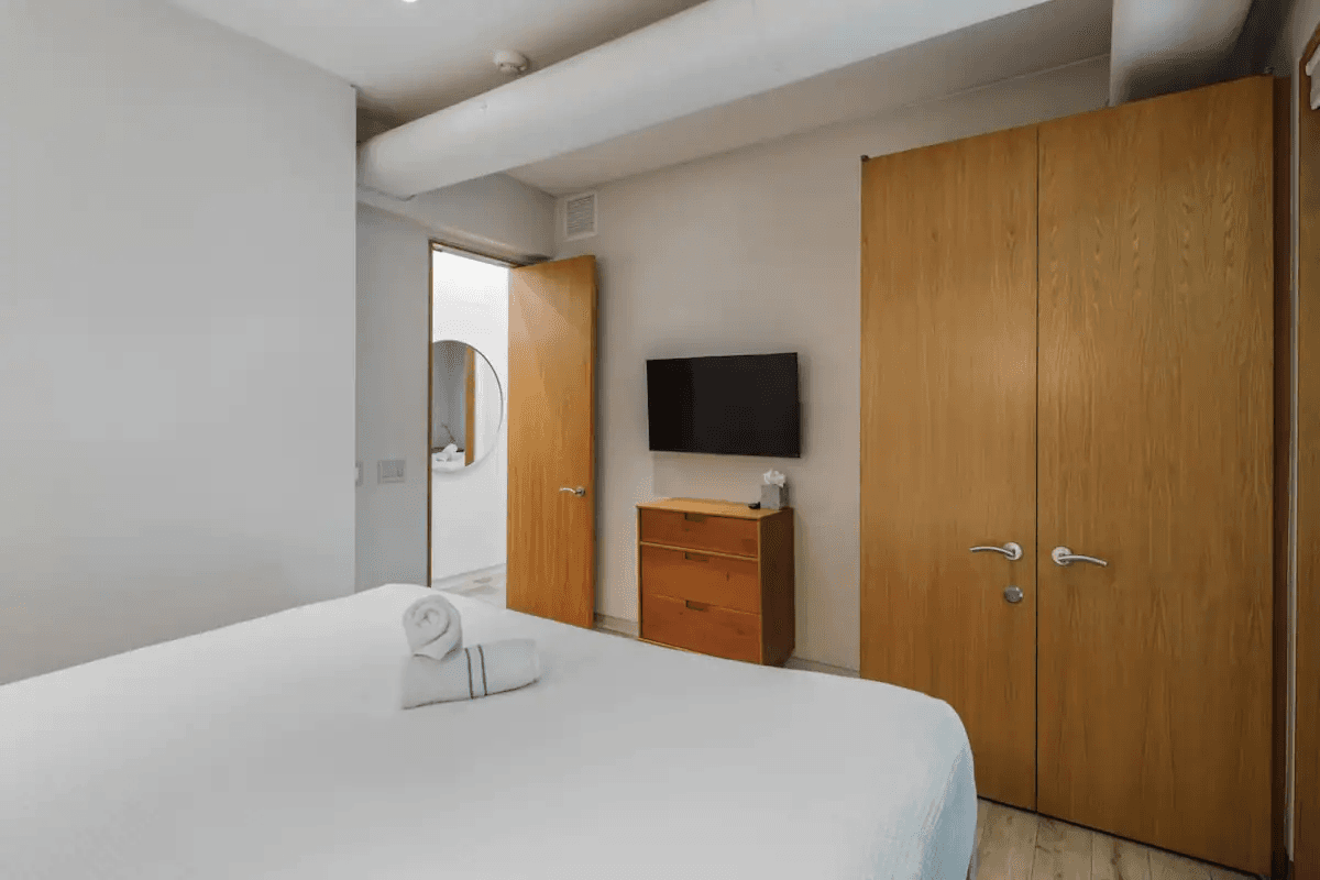 bedroom with minimalist decor, blending style and comfort in contemporary Key West lodging