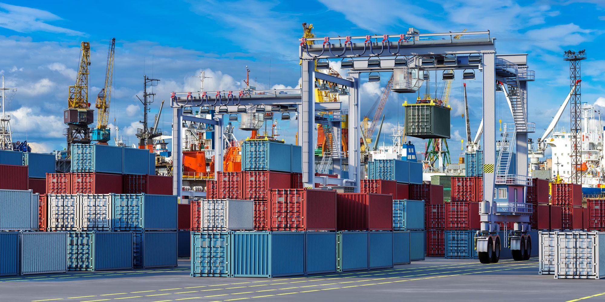 View of containers in motion at a large logistics hub located in a port.