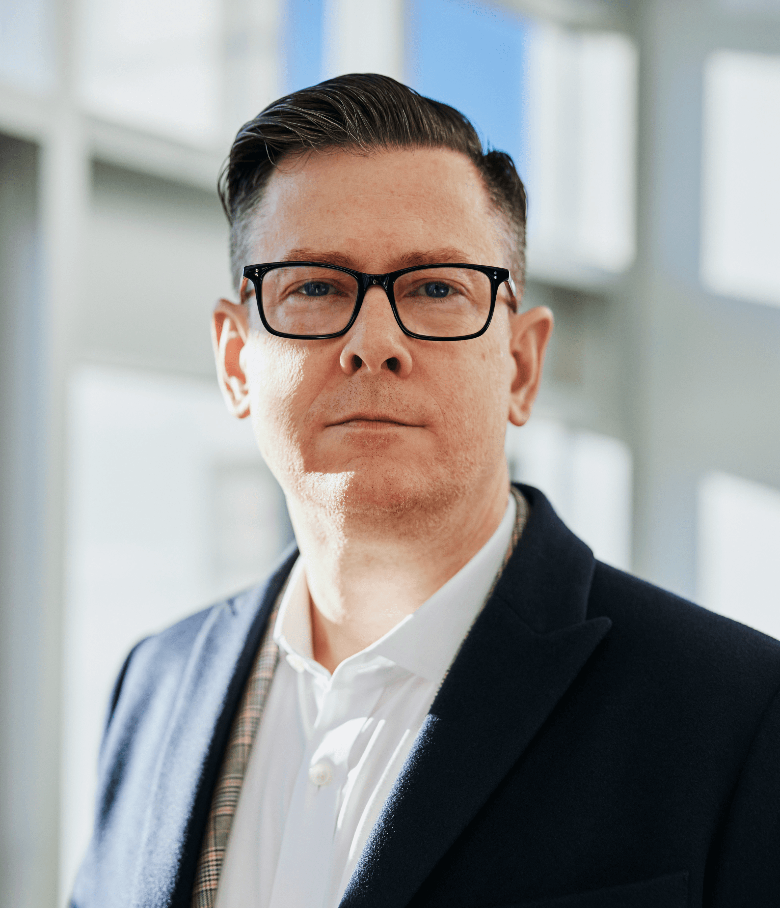 man standing beside wall