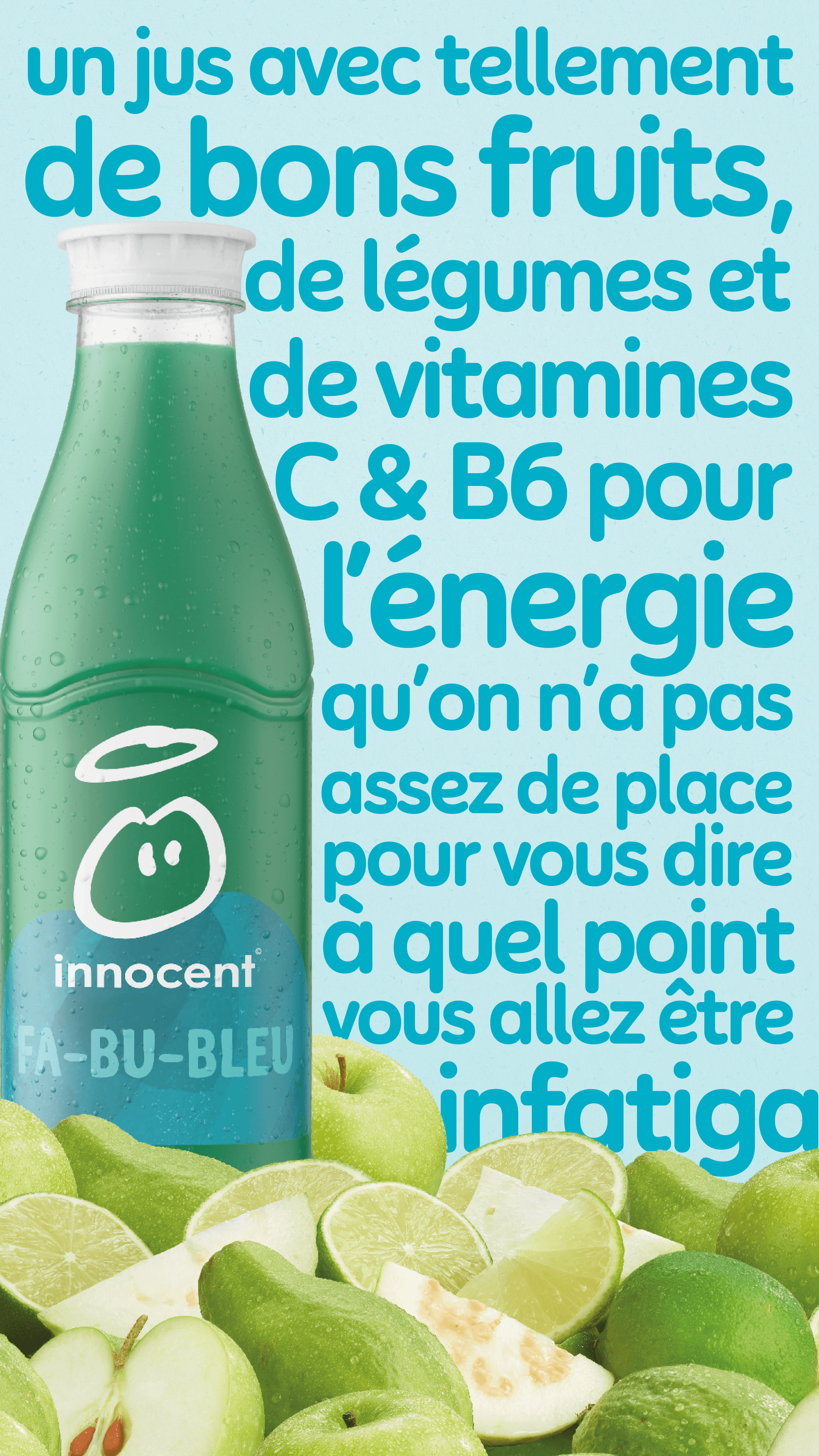 A green innocent Energy bottle surrounded by citrus fruit.