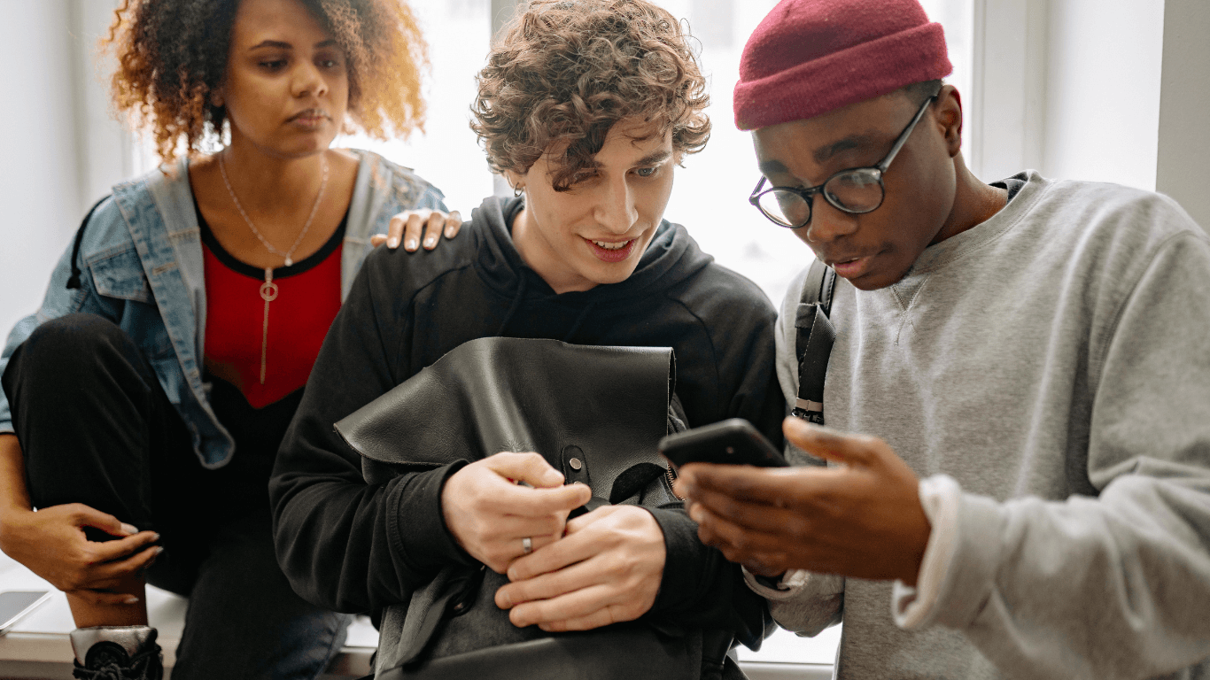 Roommates setting up shared household on phone together