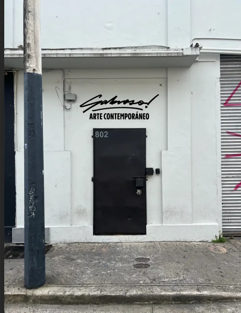 White facade and black door of Sabroso! Arte Contemporáneo in Santurce