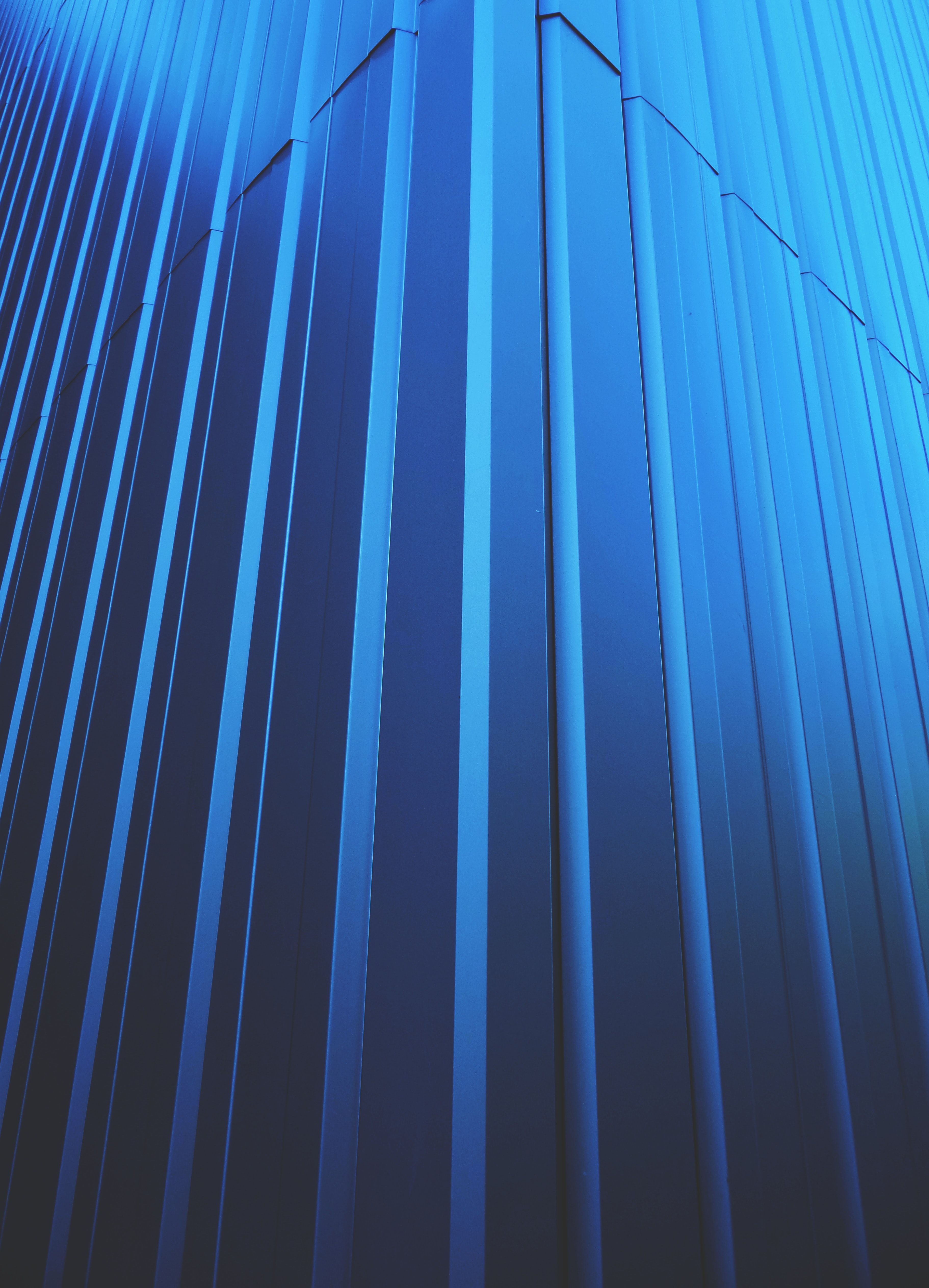 A blue and black abstract background with lines