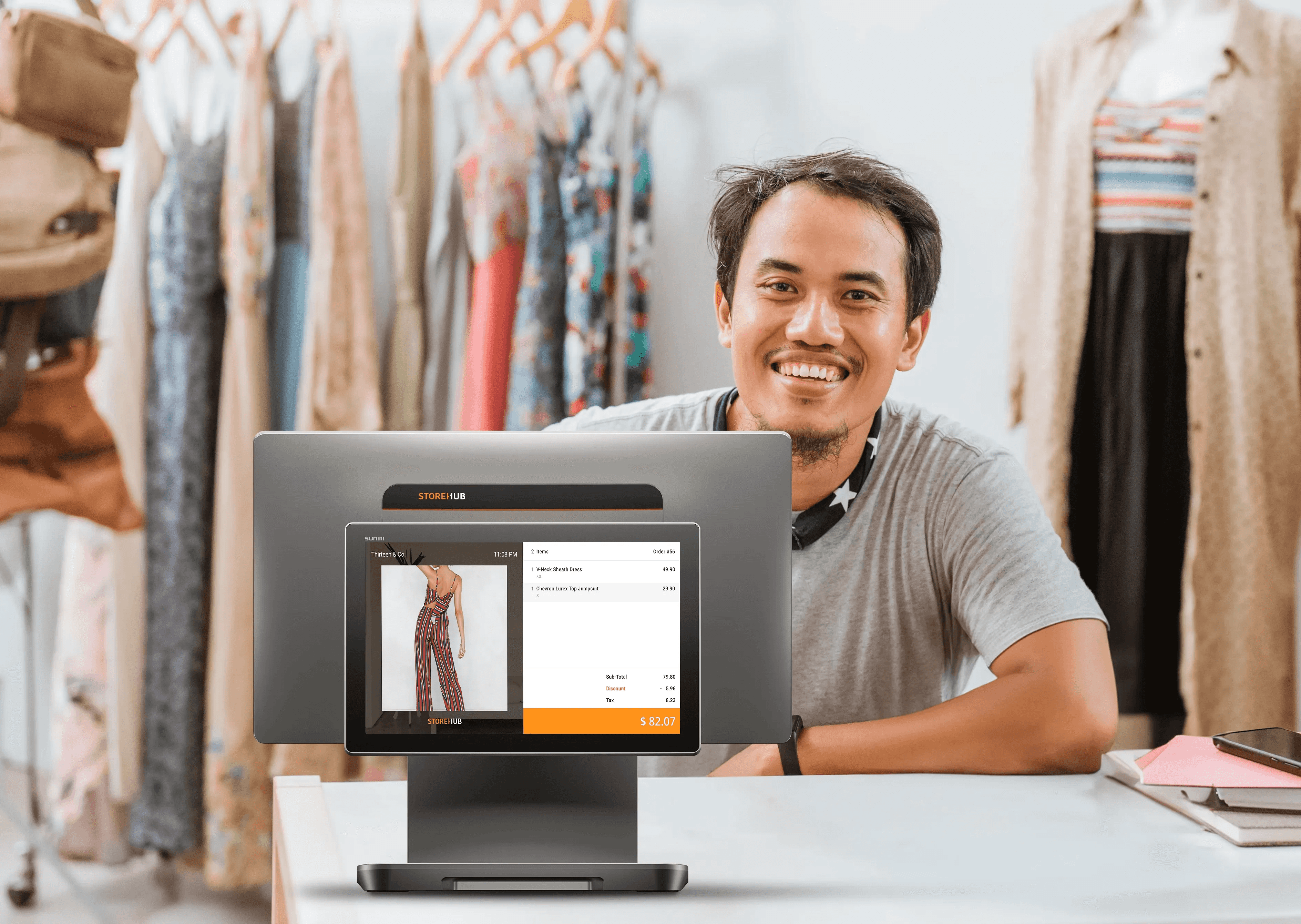 Retail business owner using the StoreHub cloud POS system for inventory management and sales reporting.