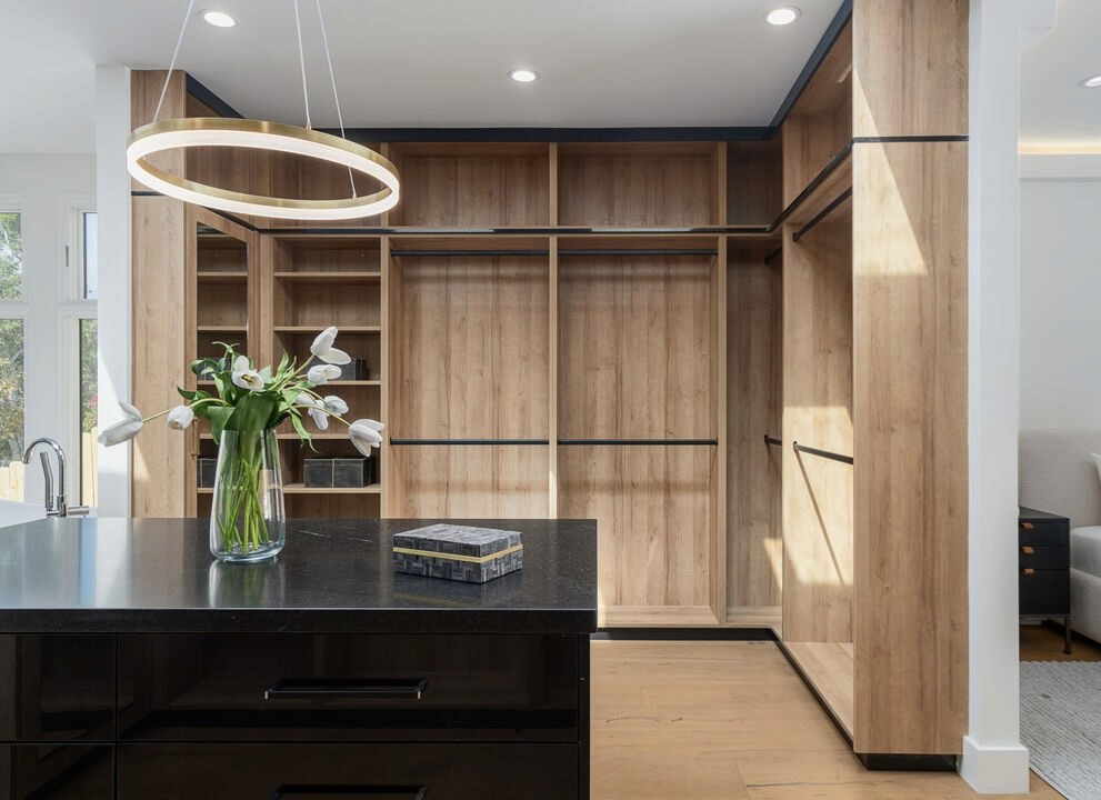 master closet with oak material black rods