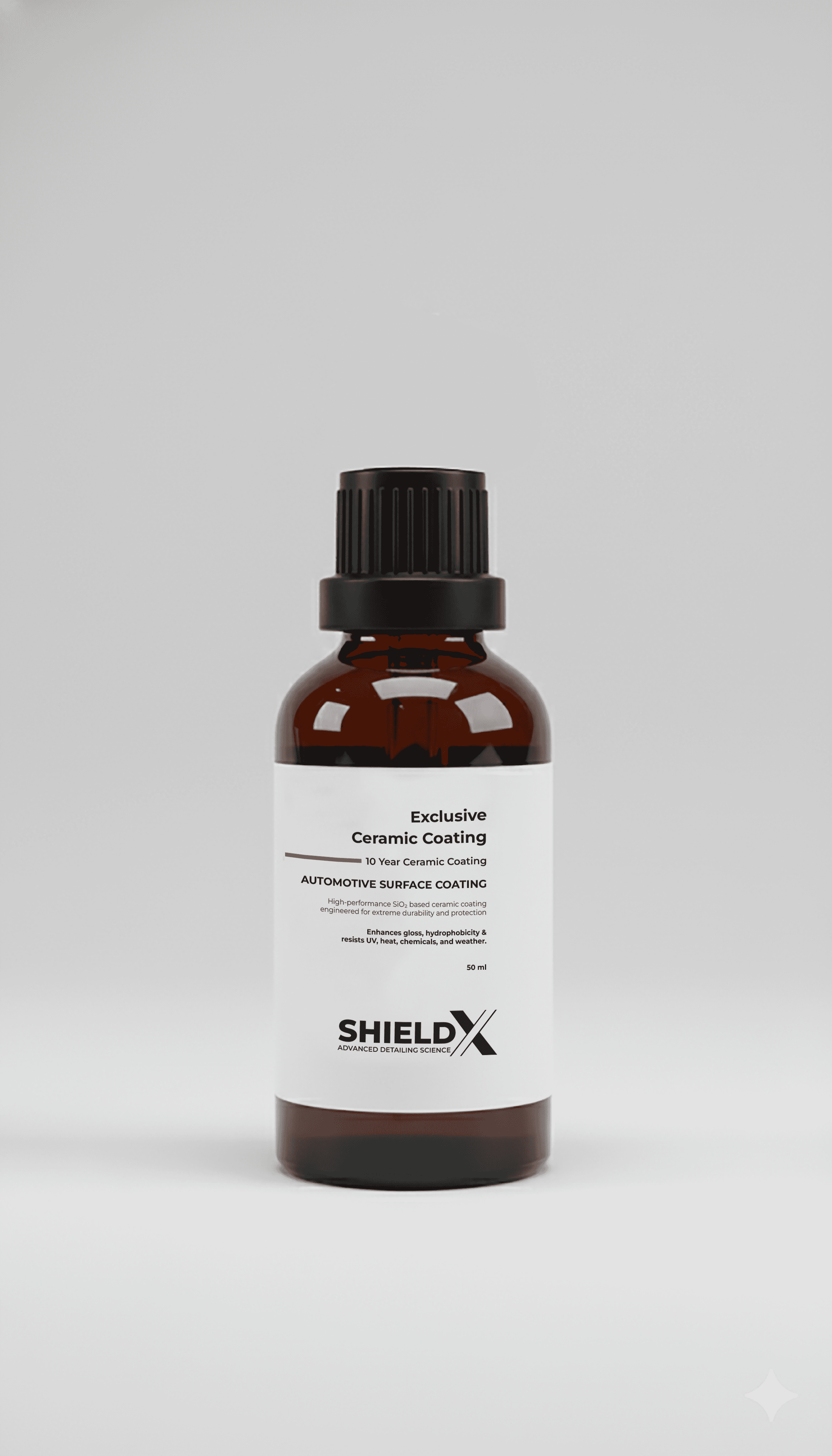 Monochrome product shot: black-capped cosmetic bottle with dynamic water splash on a clean white background.