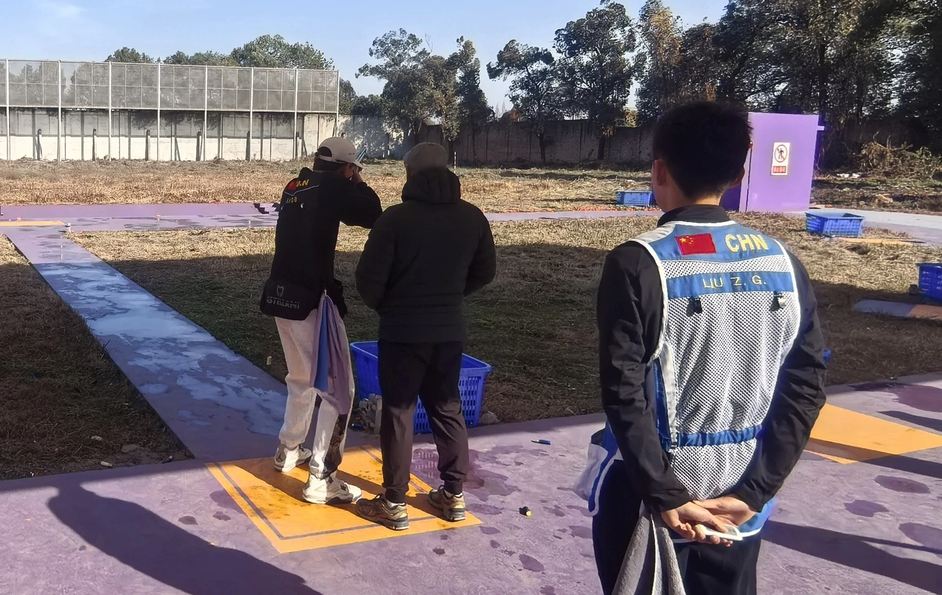 Coach and athlete practicing shoot