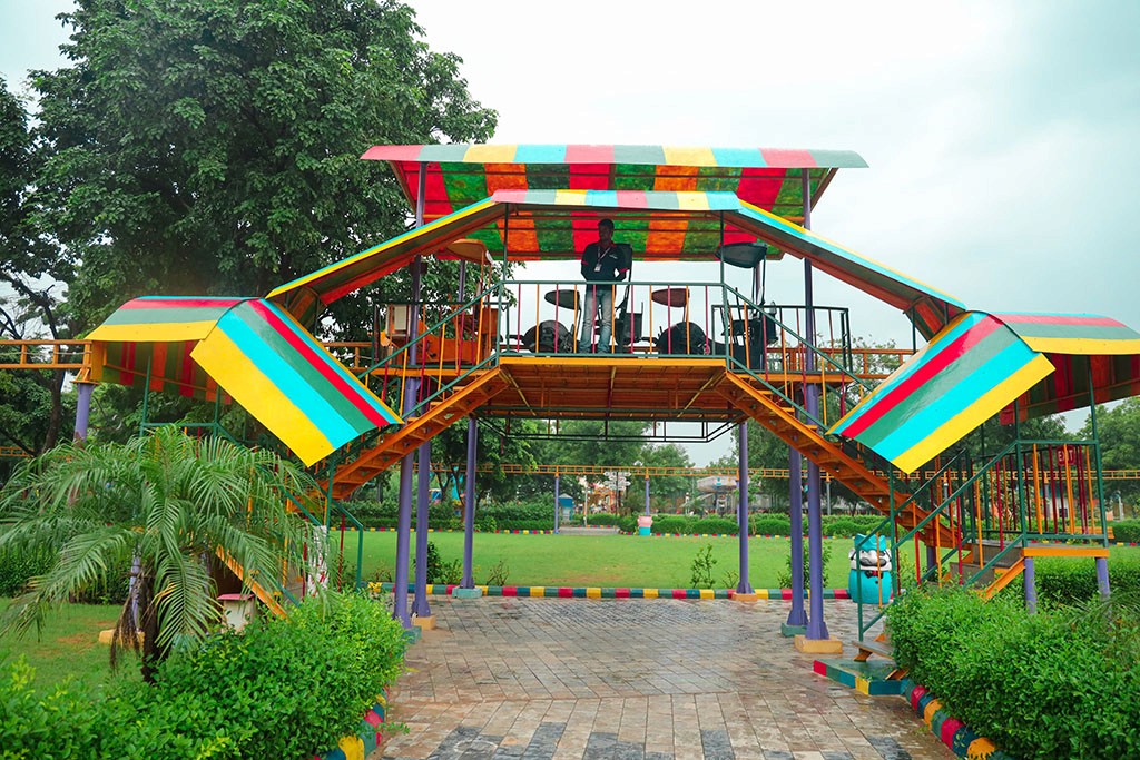 Modern orange lounge chair beside white coffee table.