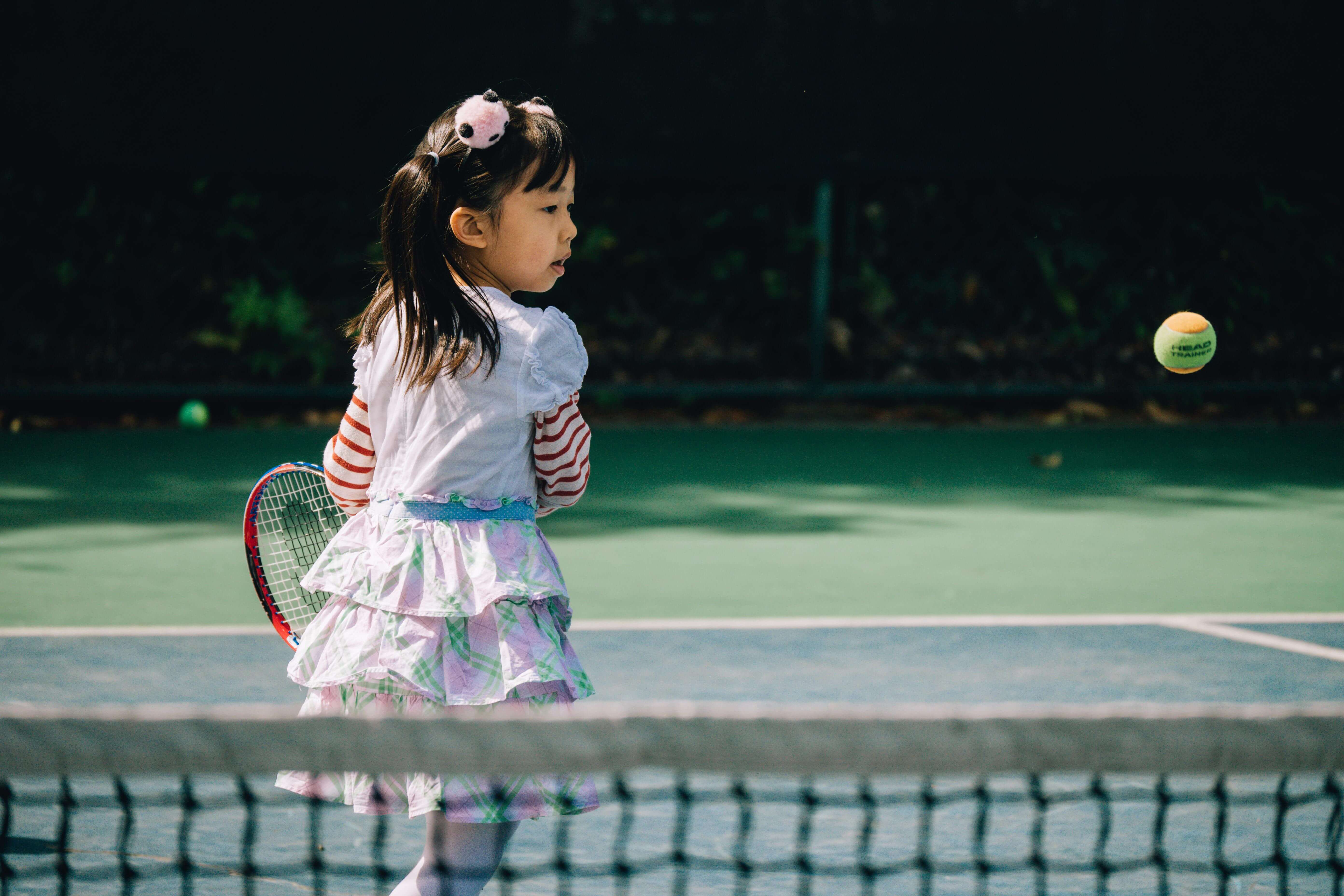 kid playing tennis