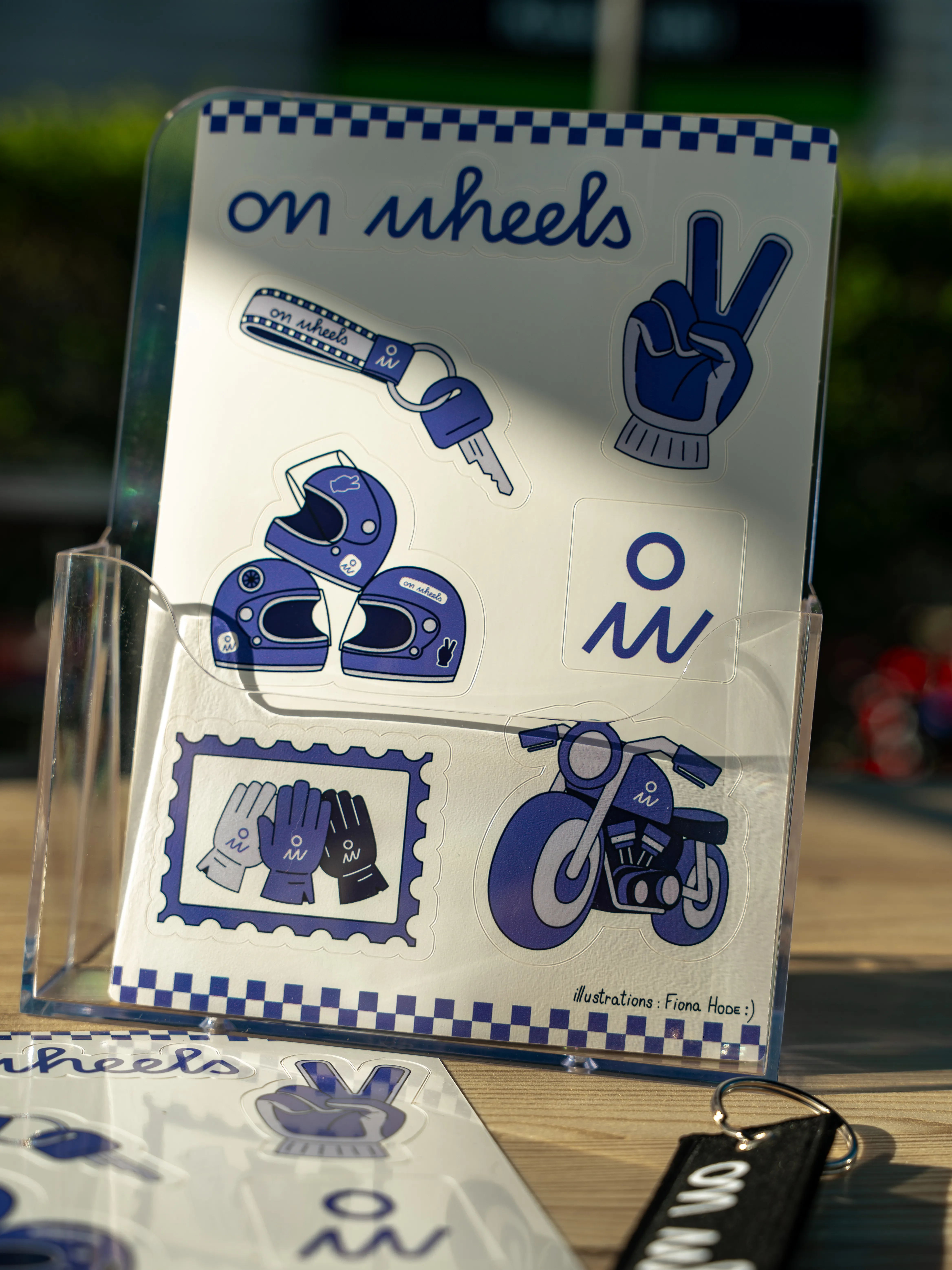 Planche de stickers On Wheels avec illustrations moto casque gants et logo