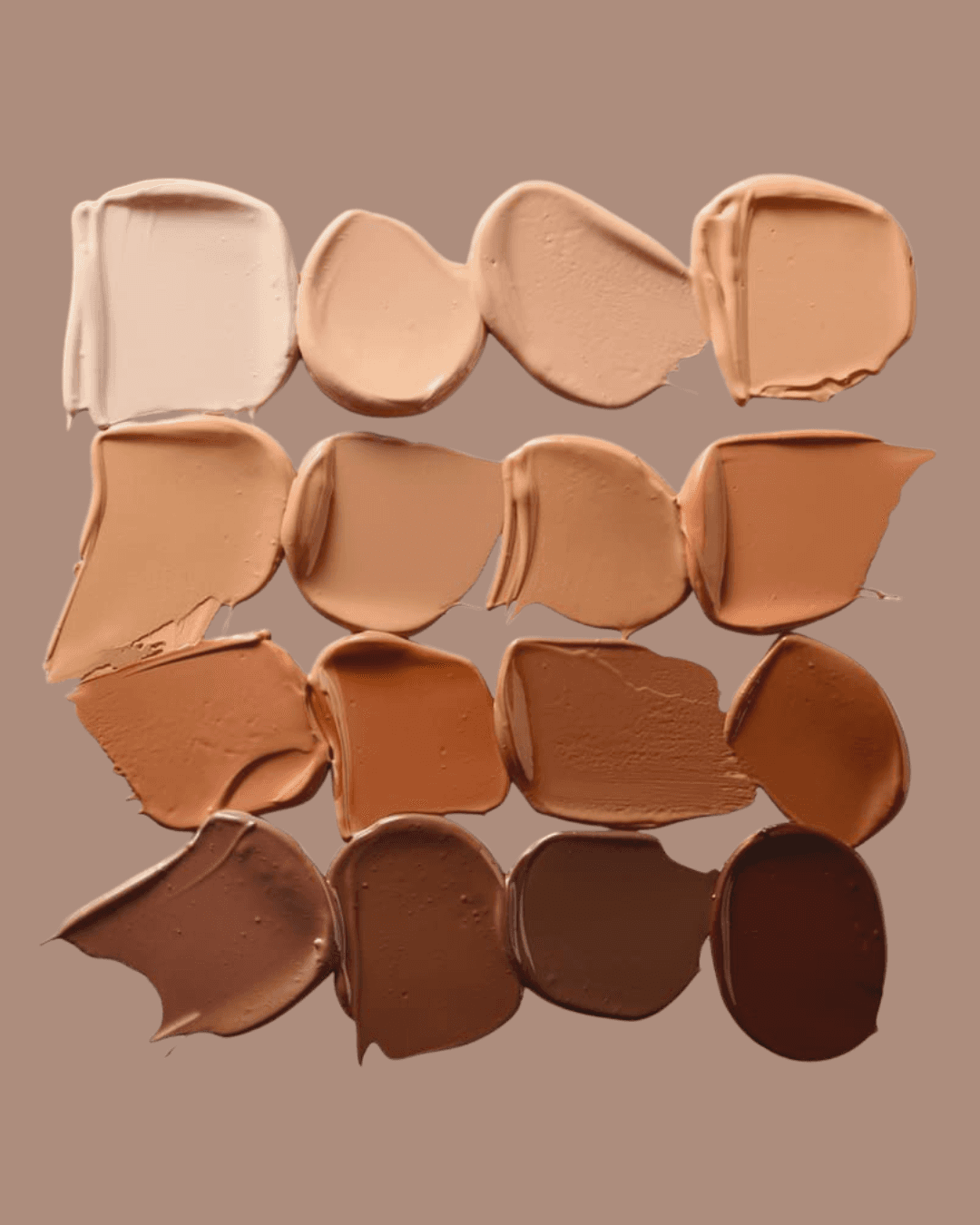 View of the French countryside through a stone villa’s open living room, with sofas and trees framing the scene