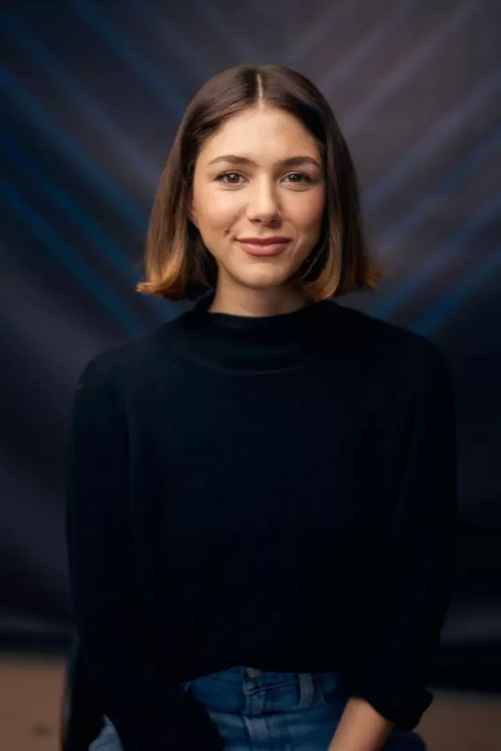Professional headshot of Victoria Costa Paz, founder of Eywa Biotech, against a soft-focus studio background.