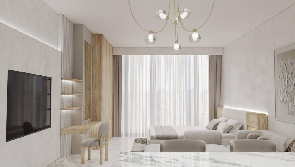 A modern bedroom featuring a bed and nightstand, located in Radiant Marina Towers.