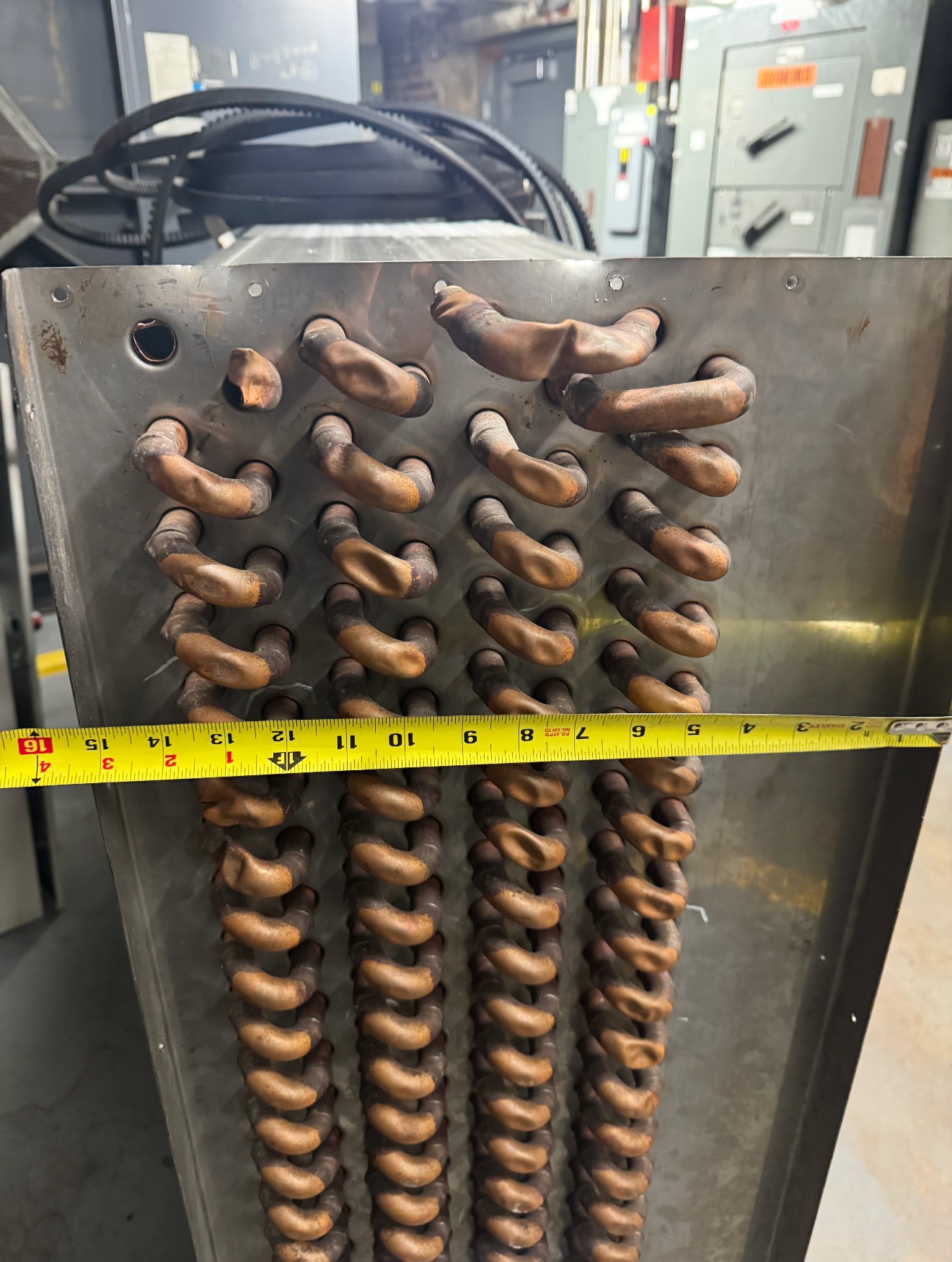Damaged chilled water coil removed from a hospital HVAC system during GRR Cooling Experts coil replacement work in New York City.