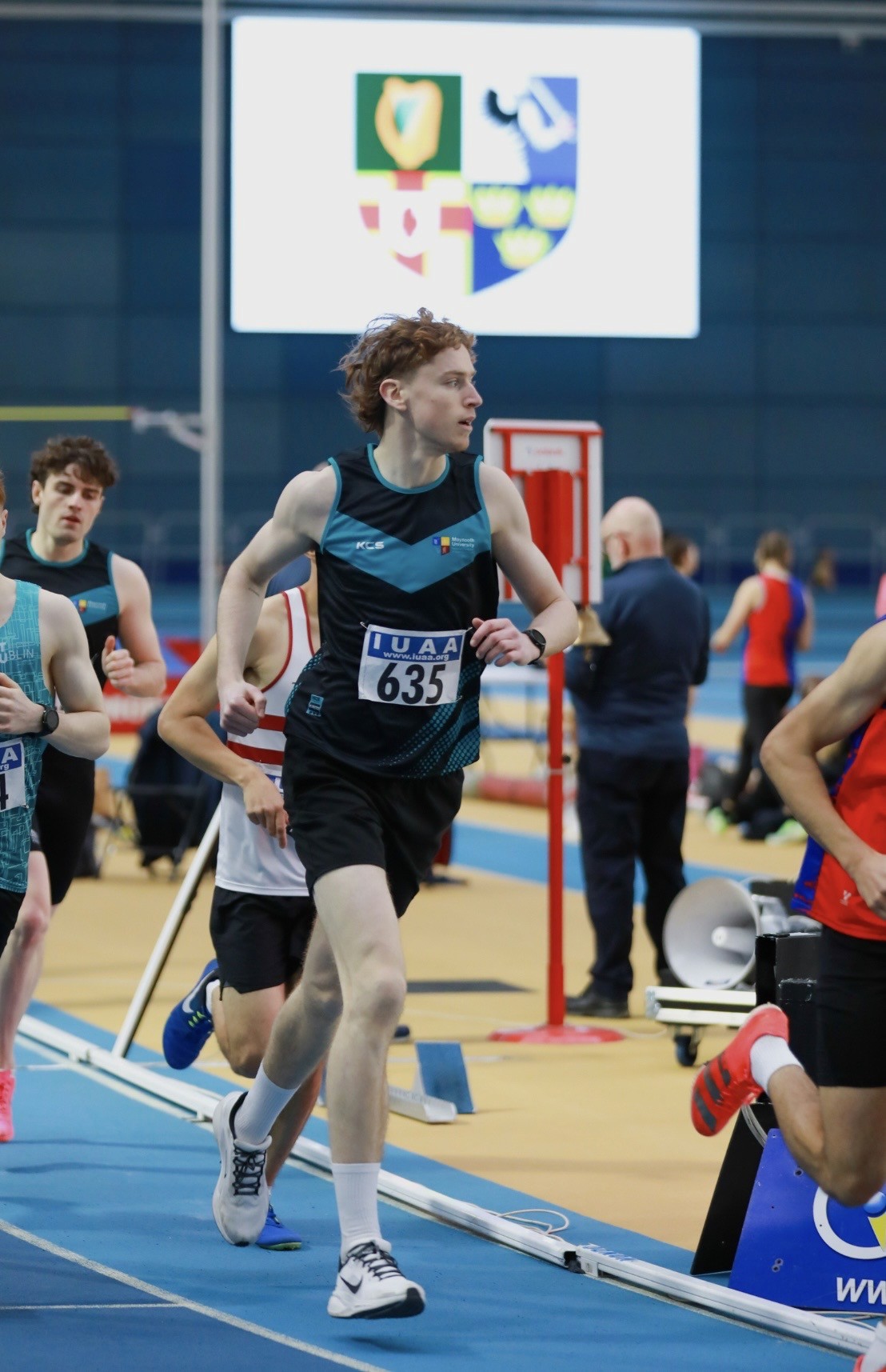 jesse competing for Maynooth Athletics on an indoor track