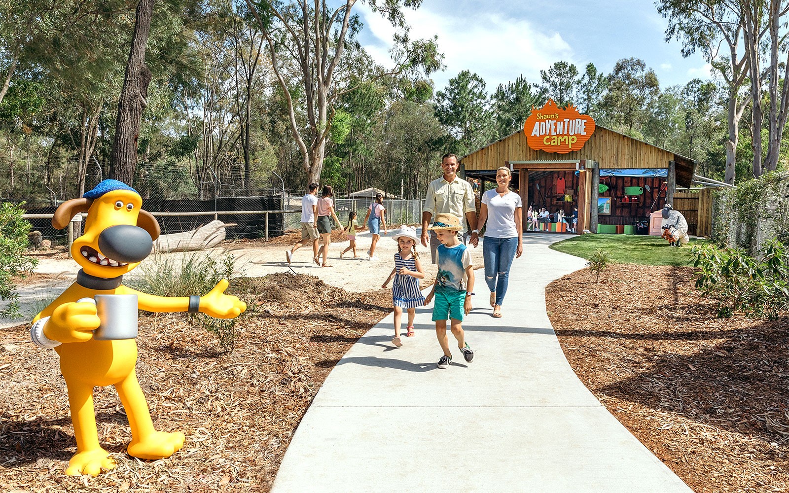 Family walking towards Shaun's Adventure Camp entrance at Paradise Country.