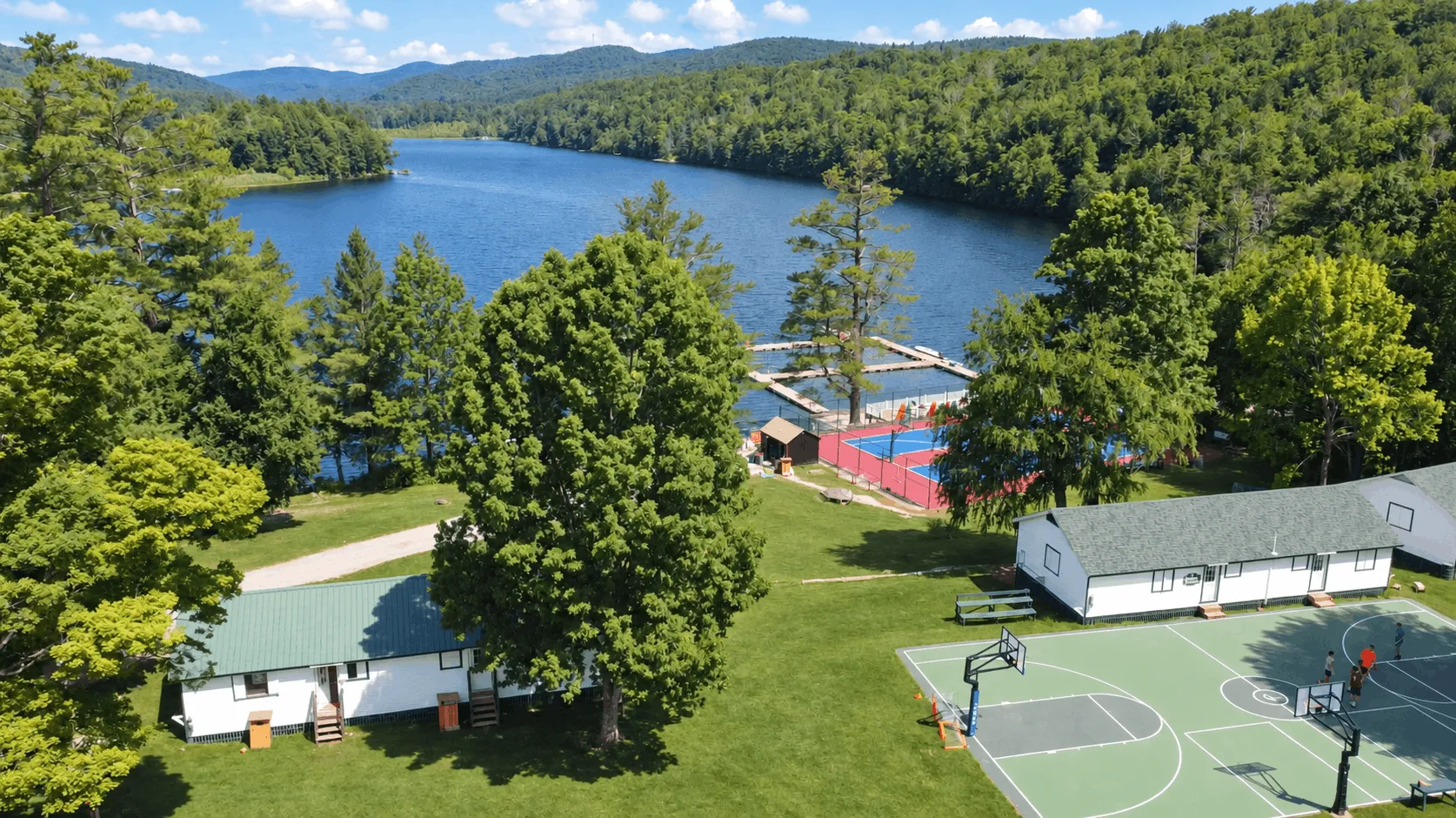 Aerial view of the lake and waterfront docks at Camp Lenox