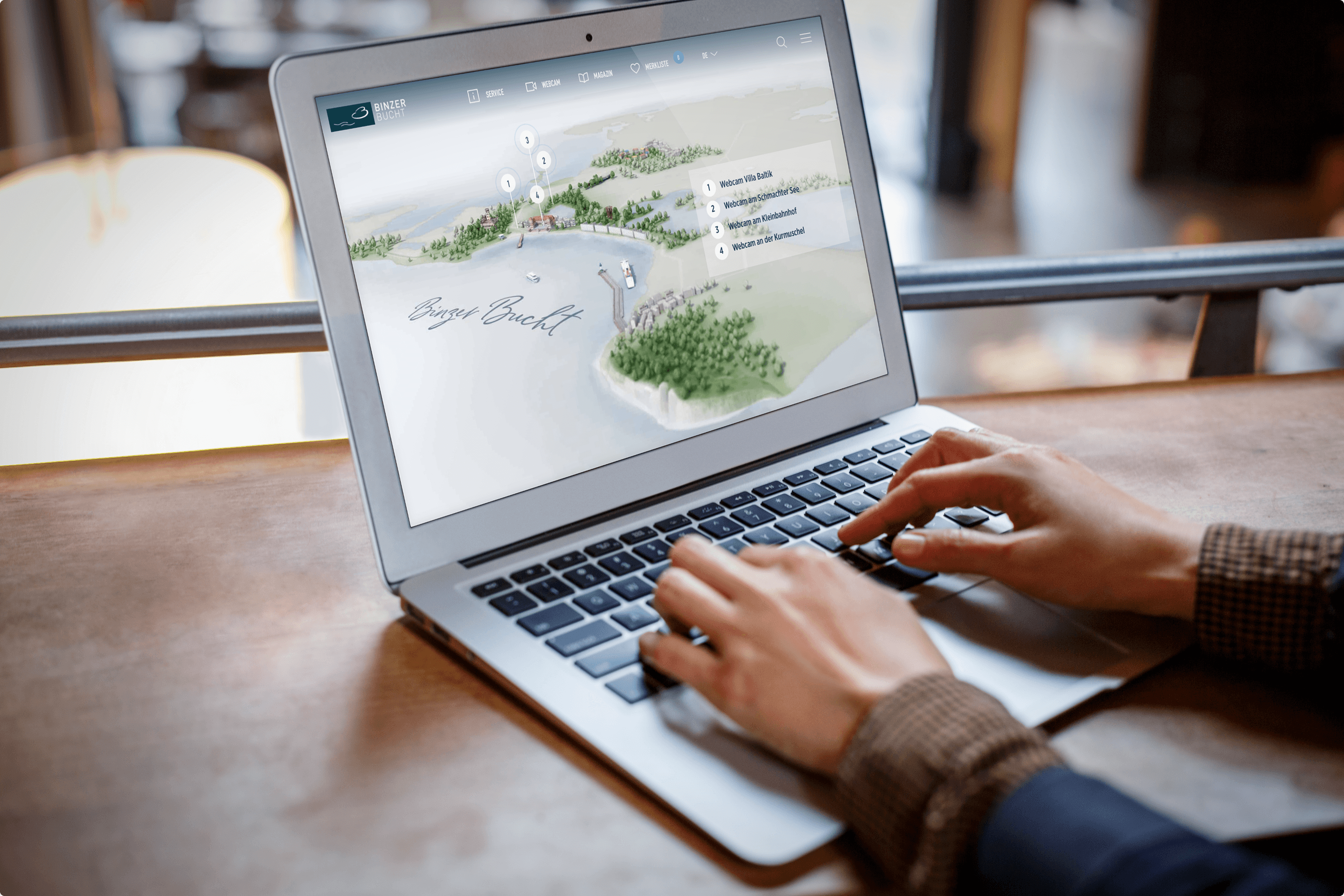 Laptop displaying map with points of interest and webcam info